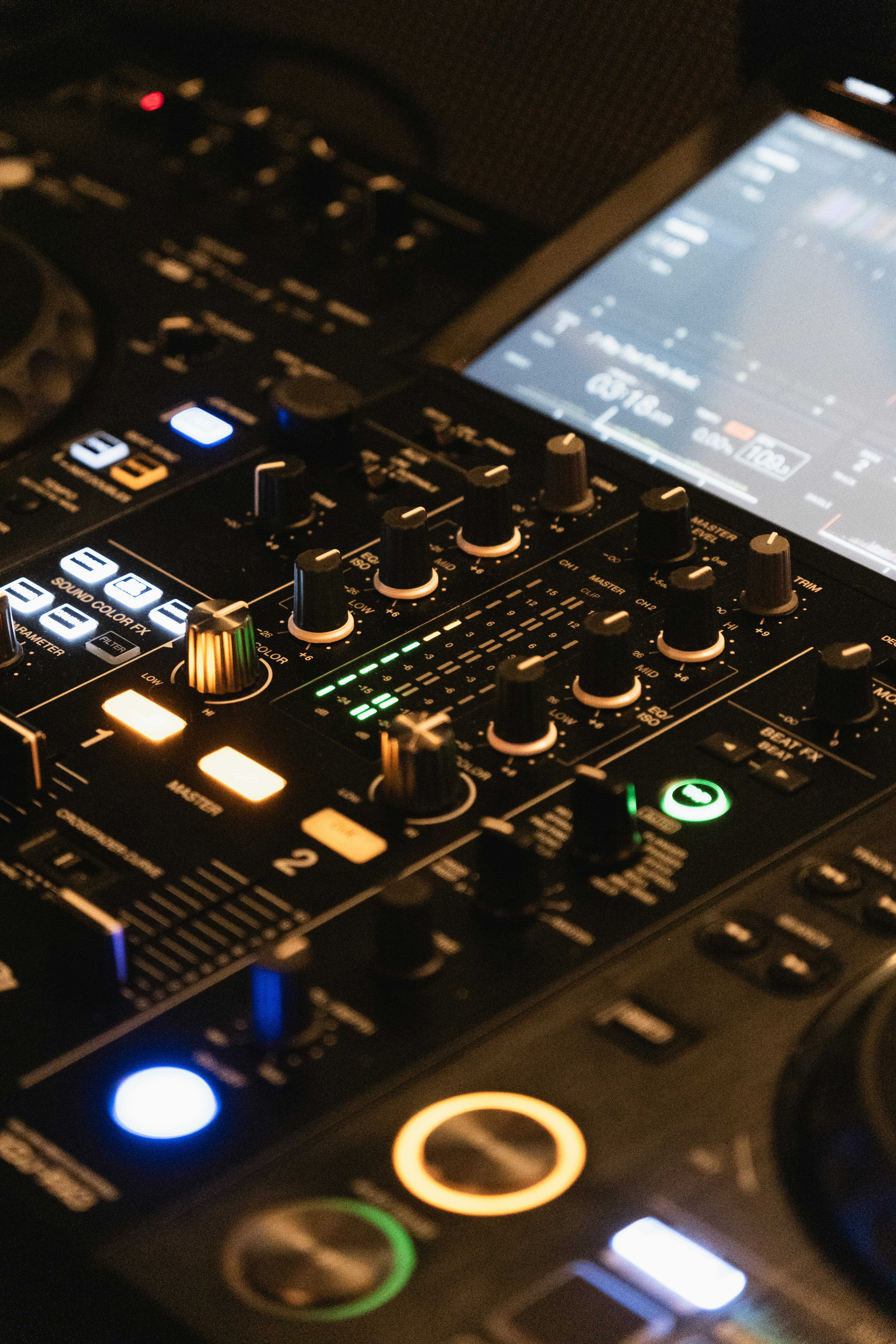 Close-up of a dj controller with illuminated buttons