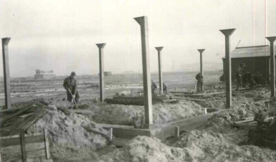 white wooden shelf near white wall