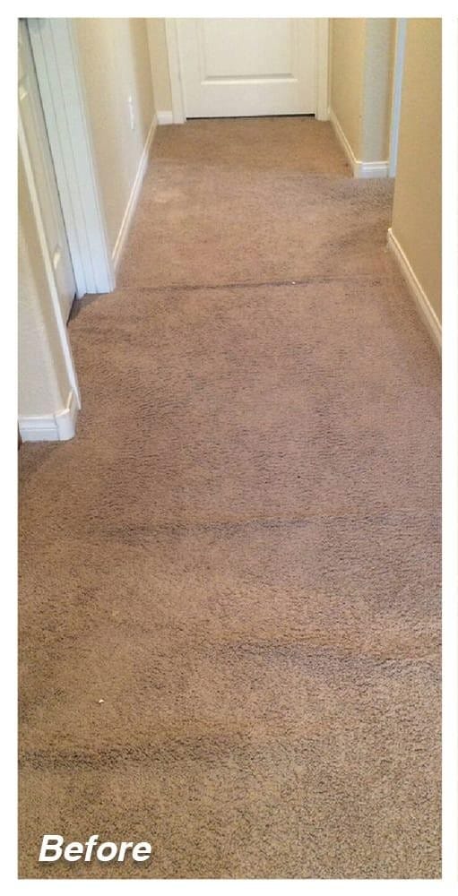 woman in white long sleeve shirt and blue denim jeans standing beside white wooden framed glass