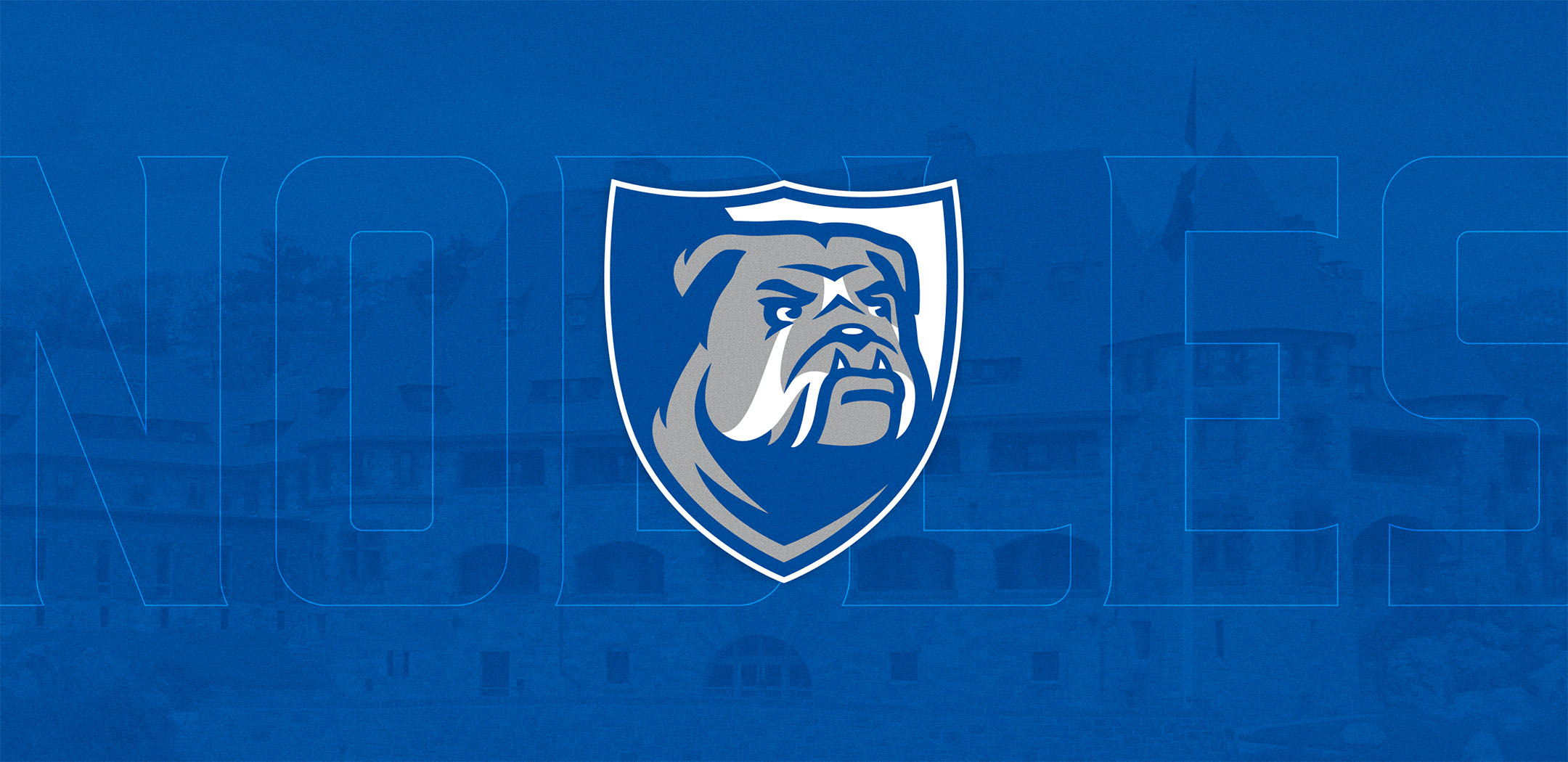 Nobles Athletics bulldog crest logo on blue background.