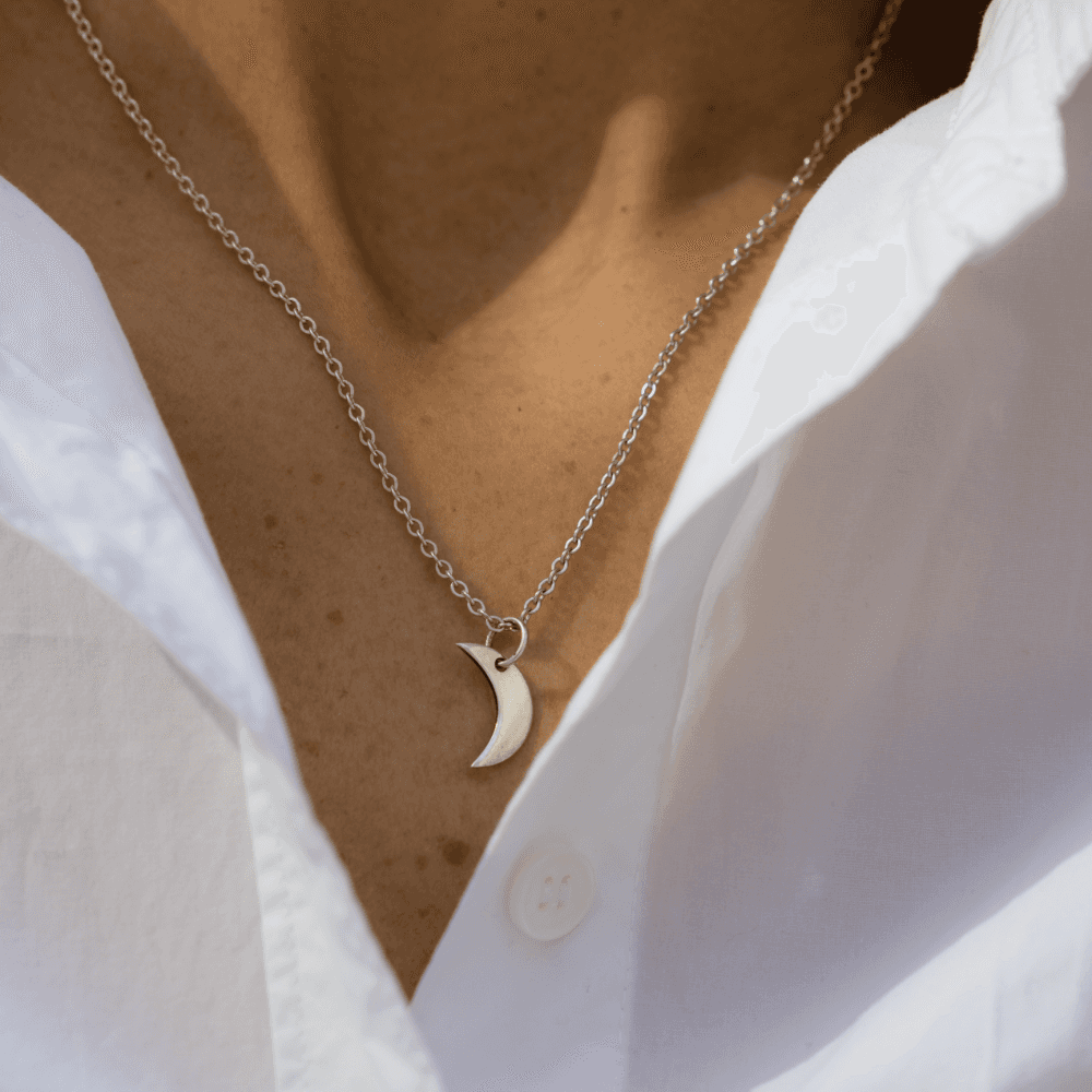 A Crescent Night Sky Moon Phase pendant.