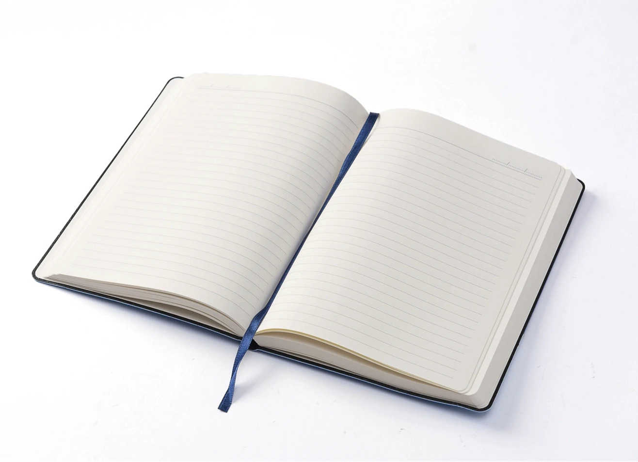 Open notebook displaying lined pages and blue bookmark.