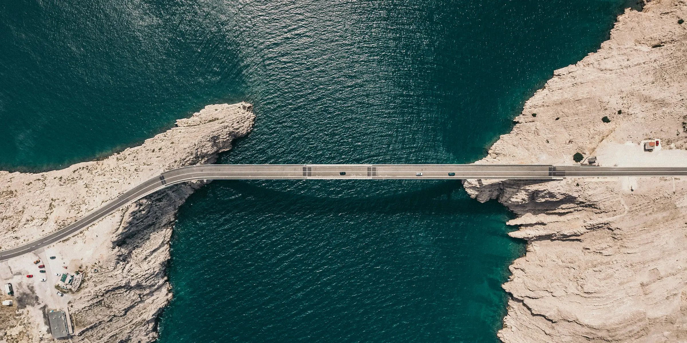 image of 4 hands each holding a coloured jigsaw piece slotting together
