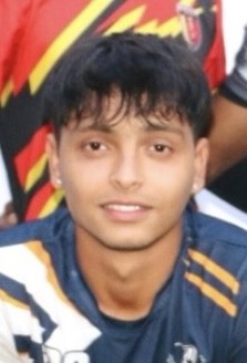 man in gray crew neck t-shirt and gray shorts sitting on basketball court