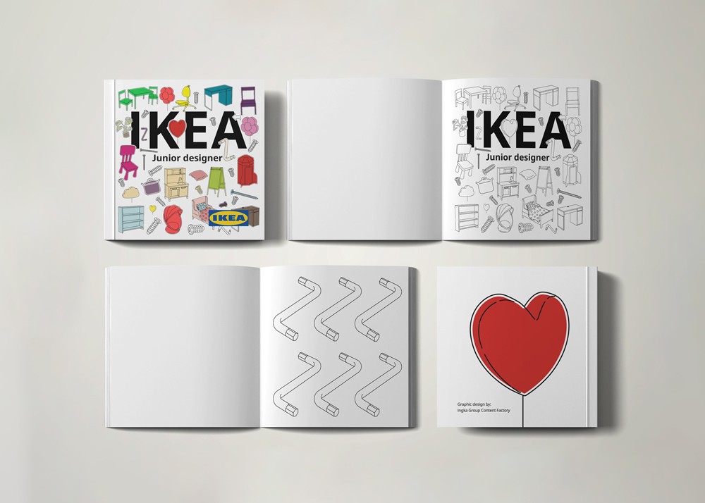 Flat lay of IKEA Junior Designers branded materials including a colorful activity booklet, grey booklet, and a red heart card arranged on a light surface.
