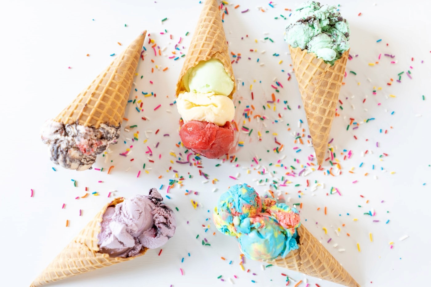 An ice cream cone topped with sprinkles