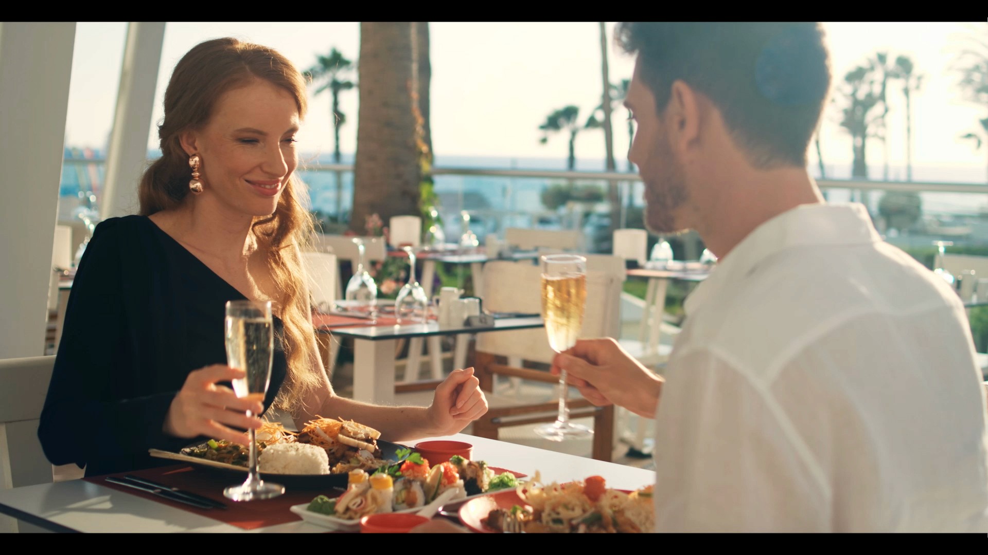 Couple is enjoying there dinner during the videography of the commercial in Pafos