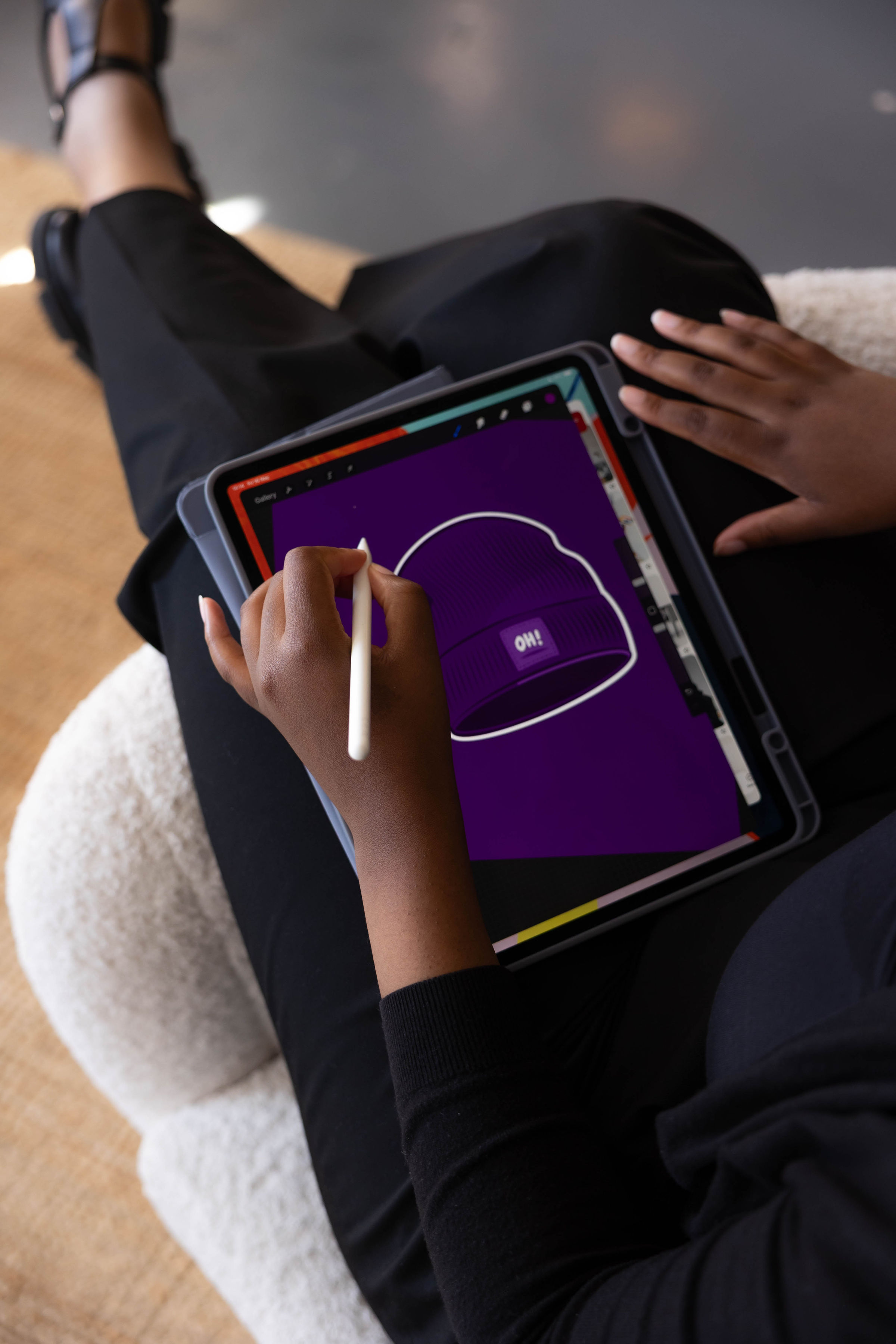 Image shows the Oh! Purple Hat logo on an ipad