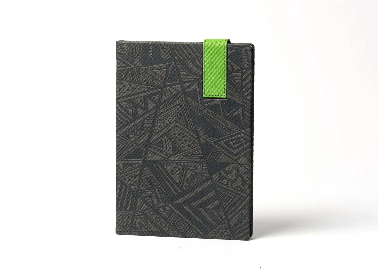 Front view of standing notebook with complex embossed design and green tab.