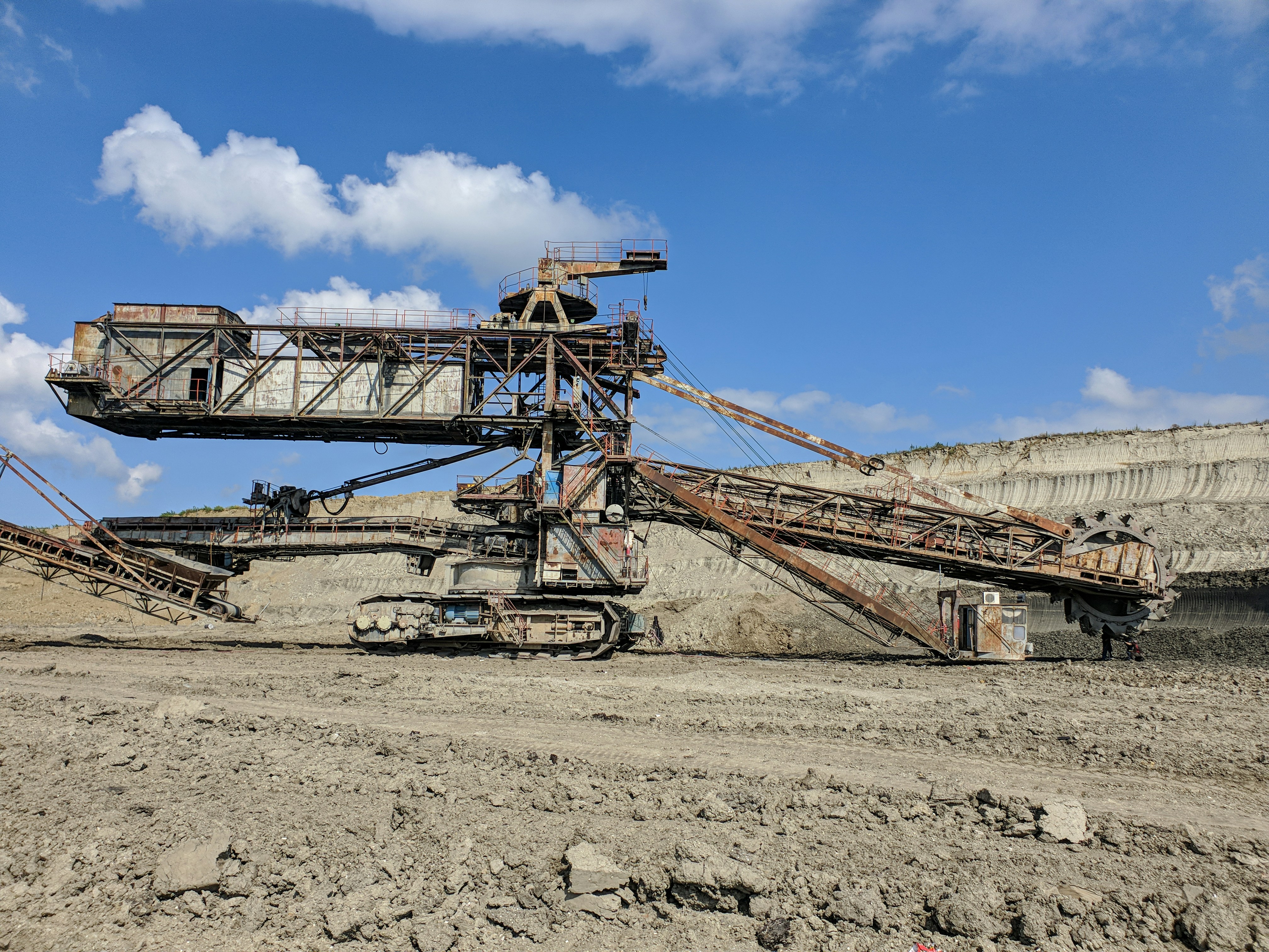 brown metal crane under blue sky during daytime