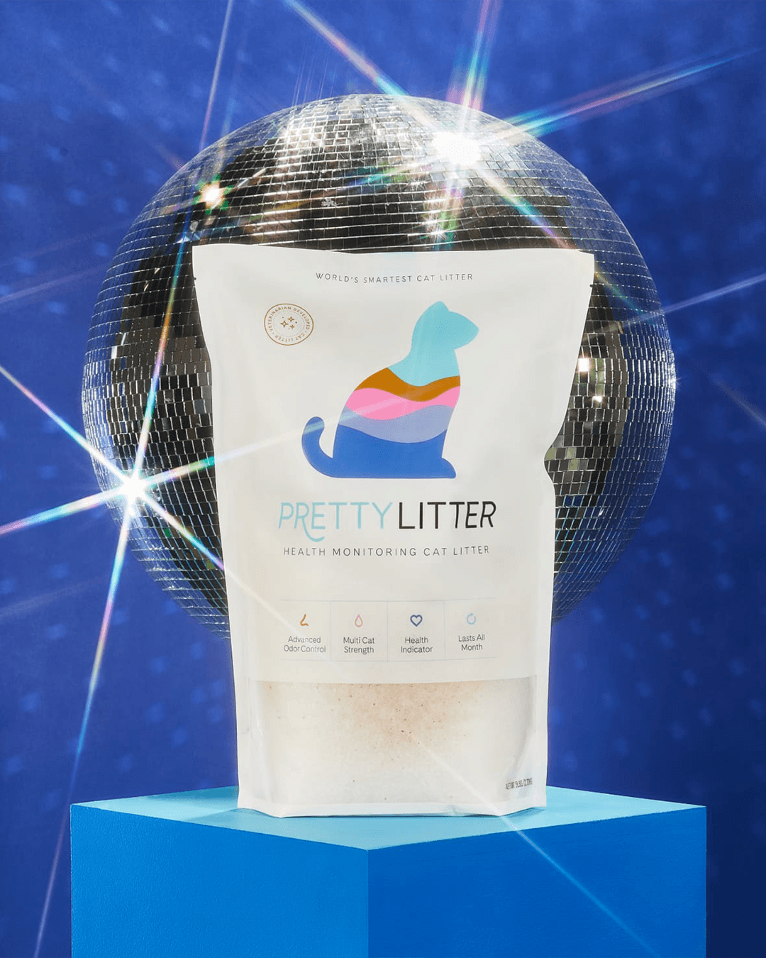 PrettyLitter brand design showing the minimal, purposeful design language applied to product packaging and DTC touchpoints, in front of a disco ball