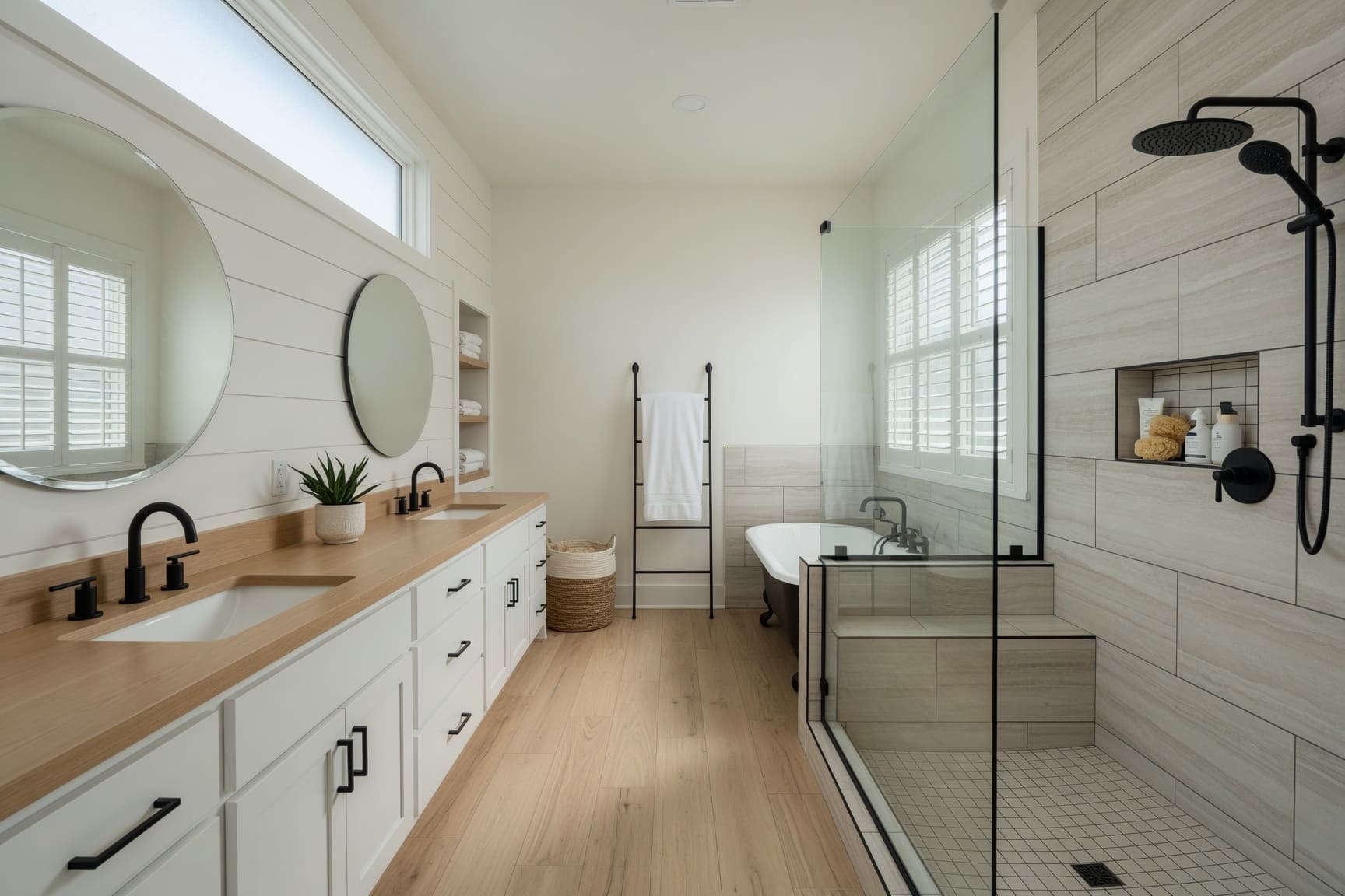 Bathroom with wood vanity, freestanding tub, and walk-in shower