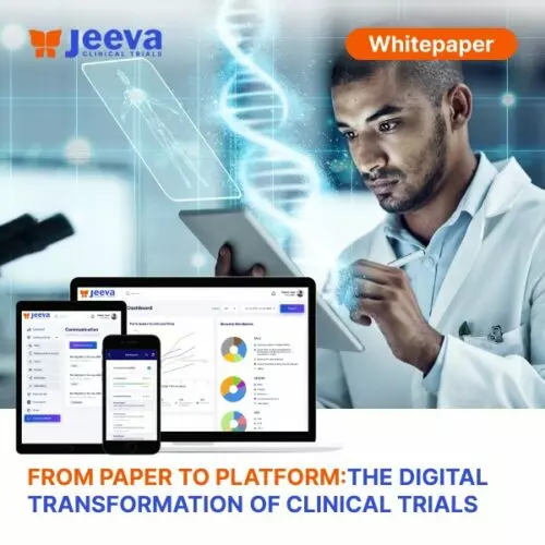 person wearing lavatory gown with green stethoscope on neck using phone while standing