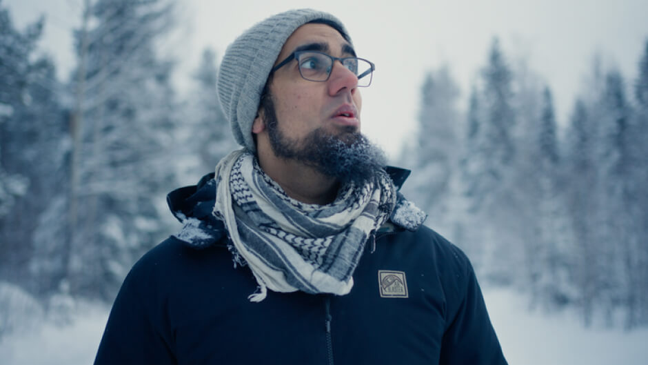 YOUSEF BJÖRN from Sweden standing in a snow covered background of trees