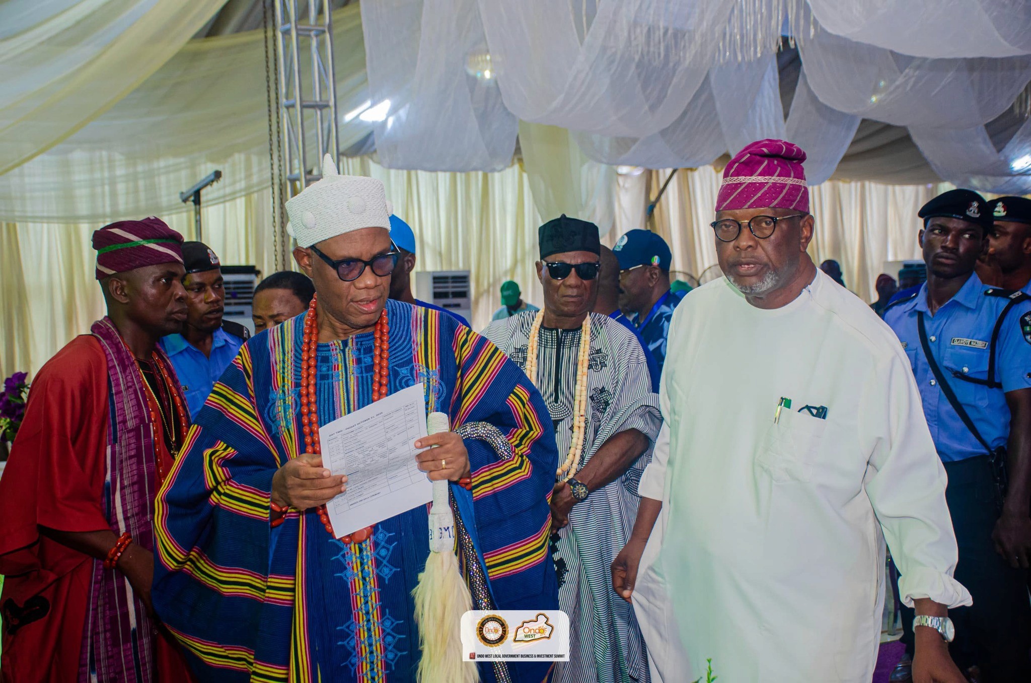 Colleagues reviewing documents and laptop data to improve conversion strategy.