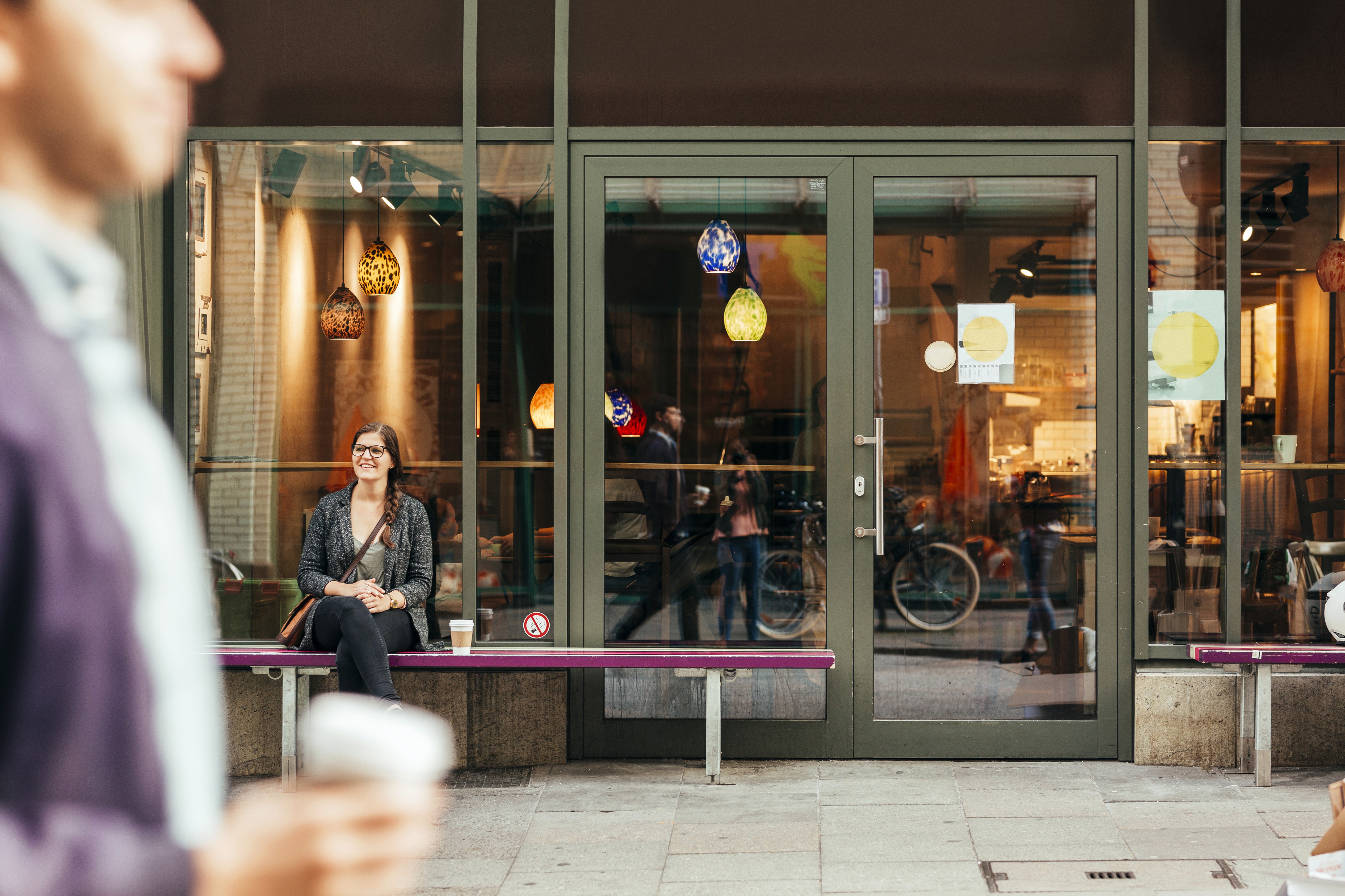 a man and a woman shaking hands in front of a laptop