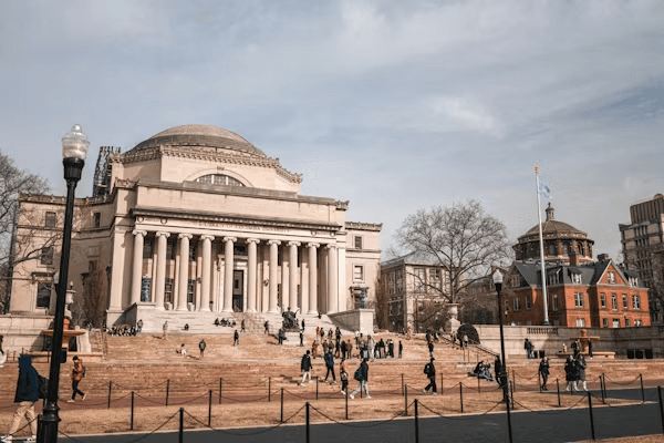 High school student conducting academic research with a PhD mentor to strengthen their Columbia University application