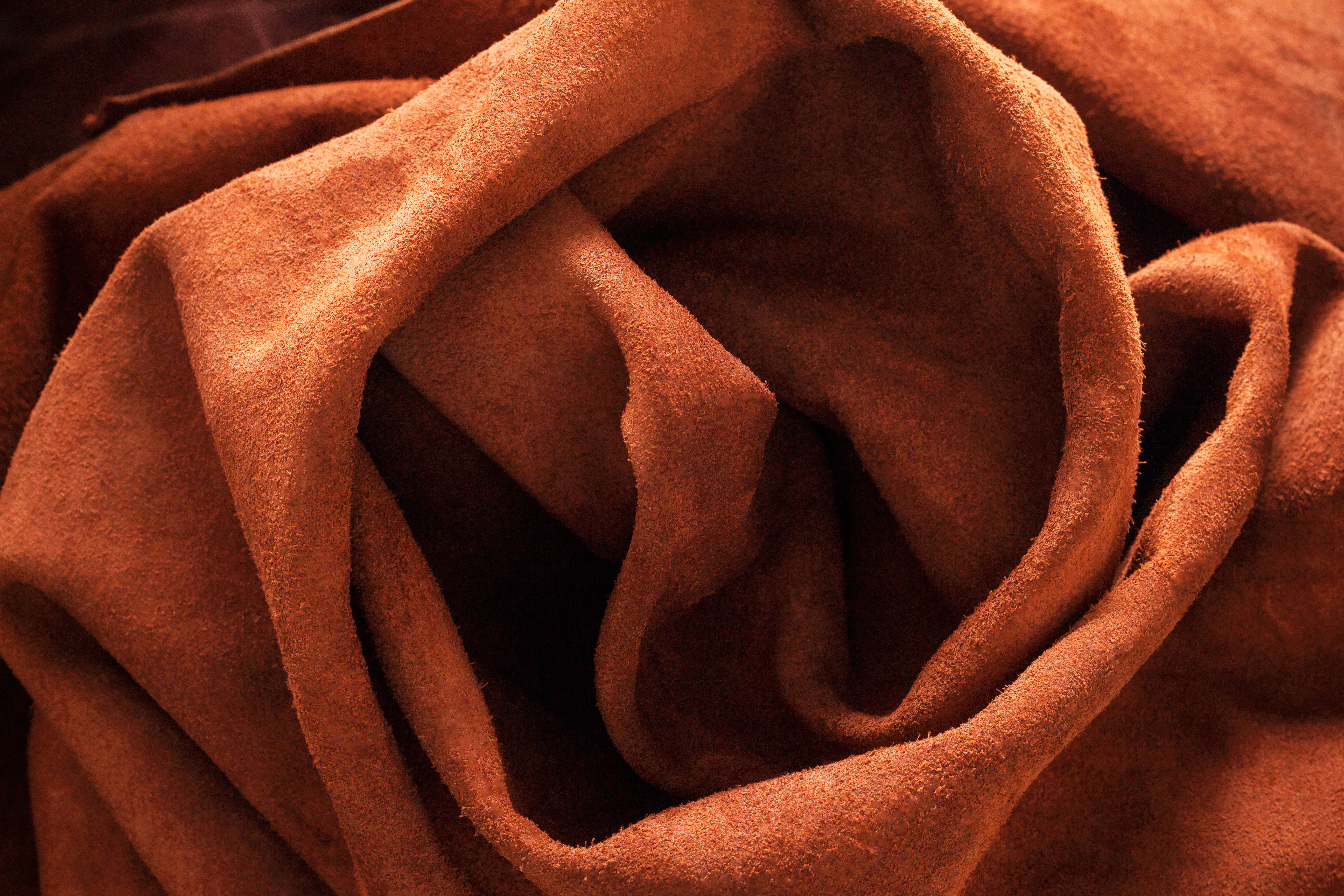 Racing car drifting through corner leaving smoke trail
