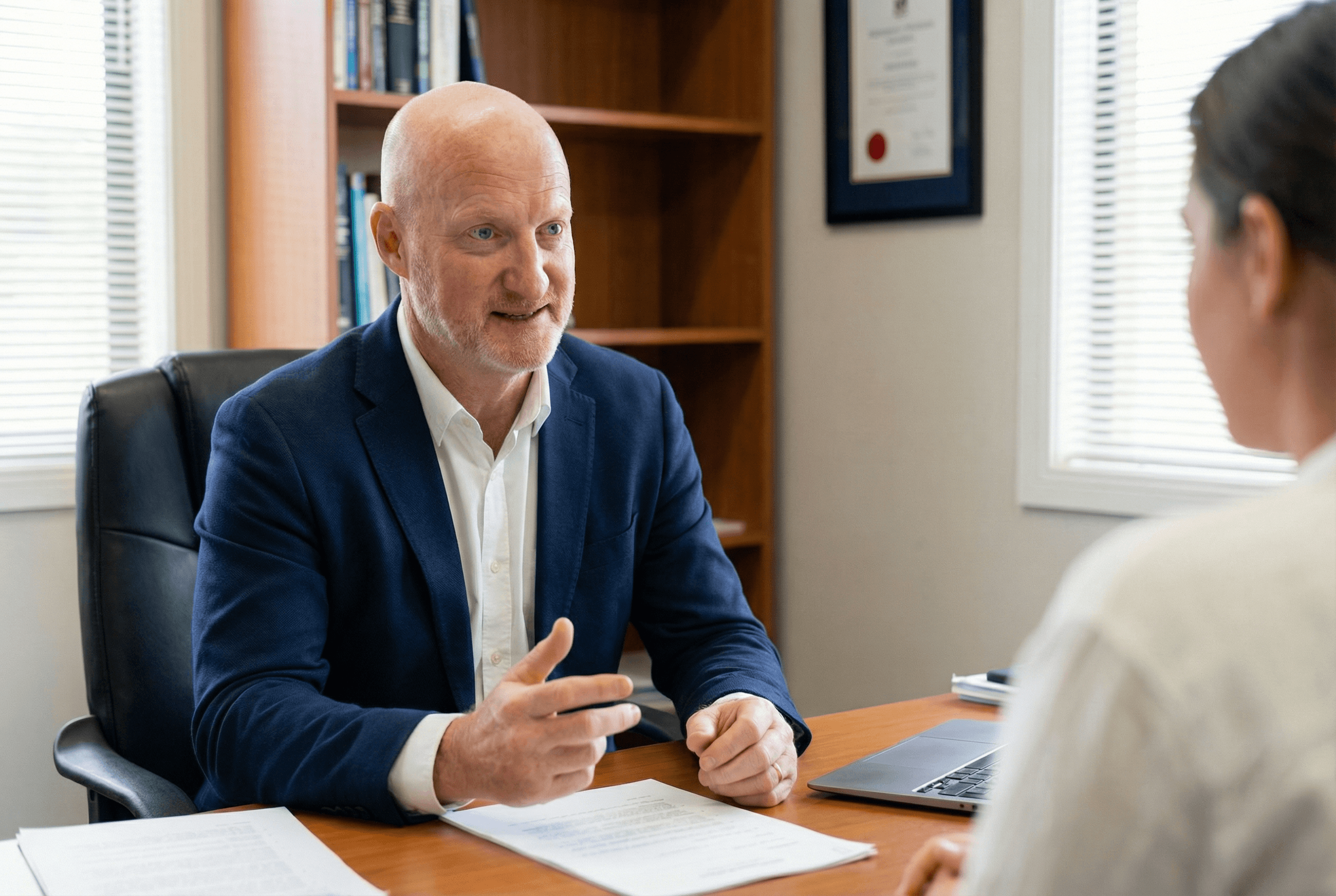 man drawing on dry-erase board