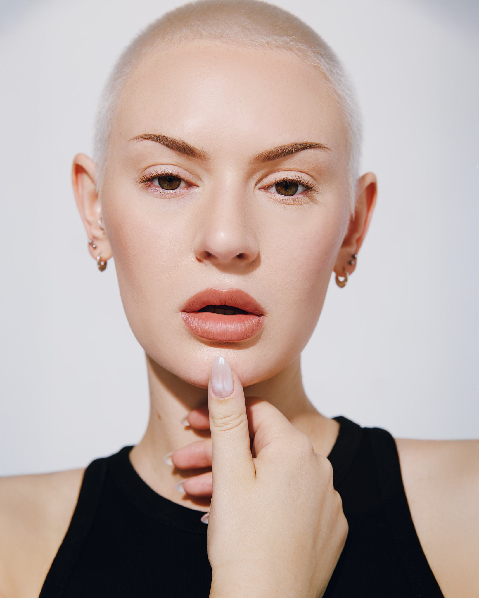 A tall waterfall cascades into a turquoise pool below.