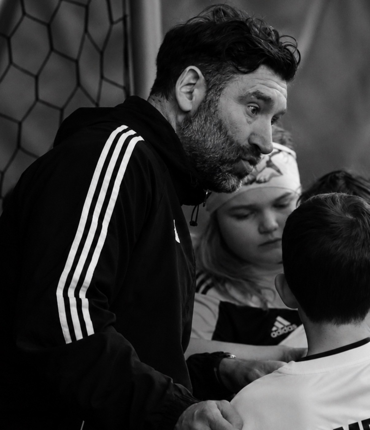 Kieran coaching young soccer players