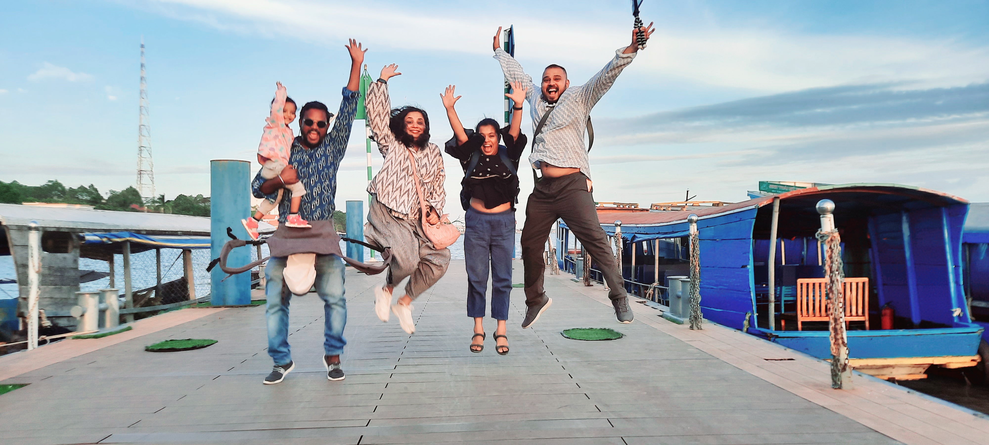 brown and white cattle in green field viewing mountain under blue sky during daytime