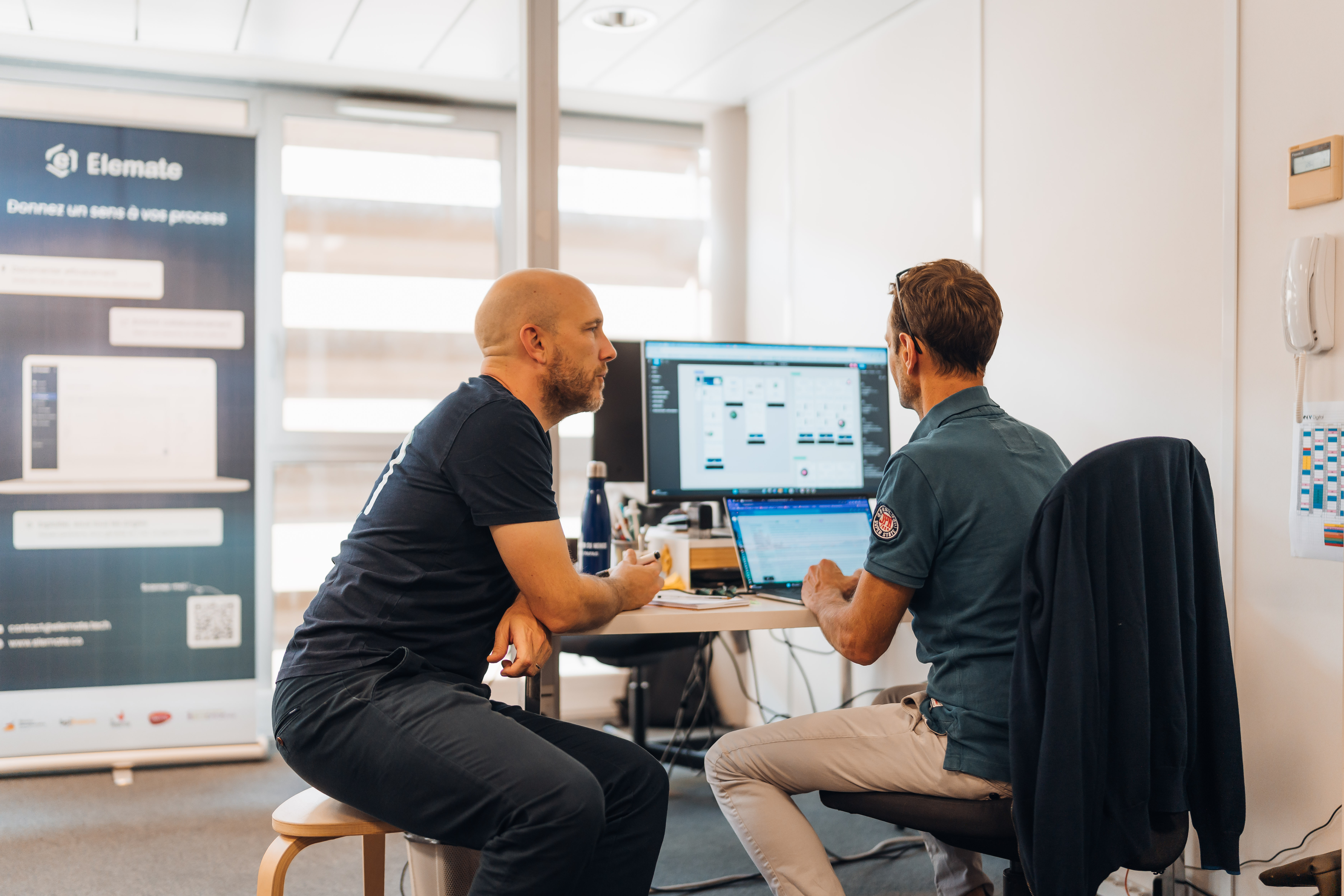 man in gray dress shirt sitting beside woman in green crew neck t-shirt