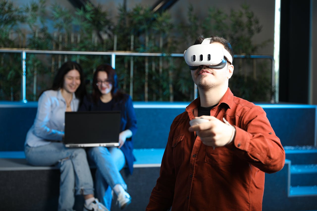 Group of young adults exploring virtual reality technology indoors, creating an interactive experience.