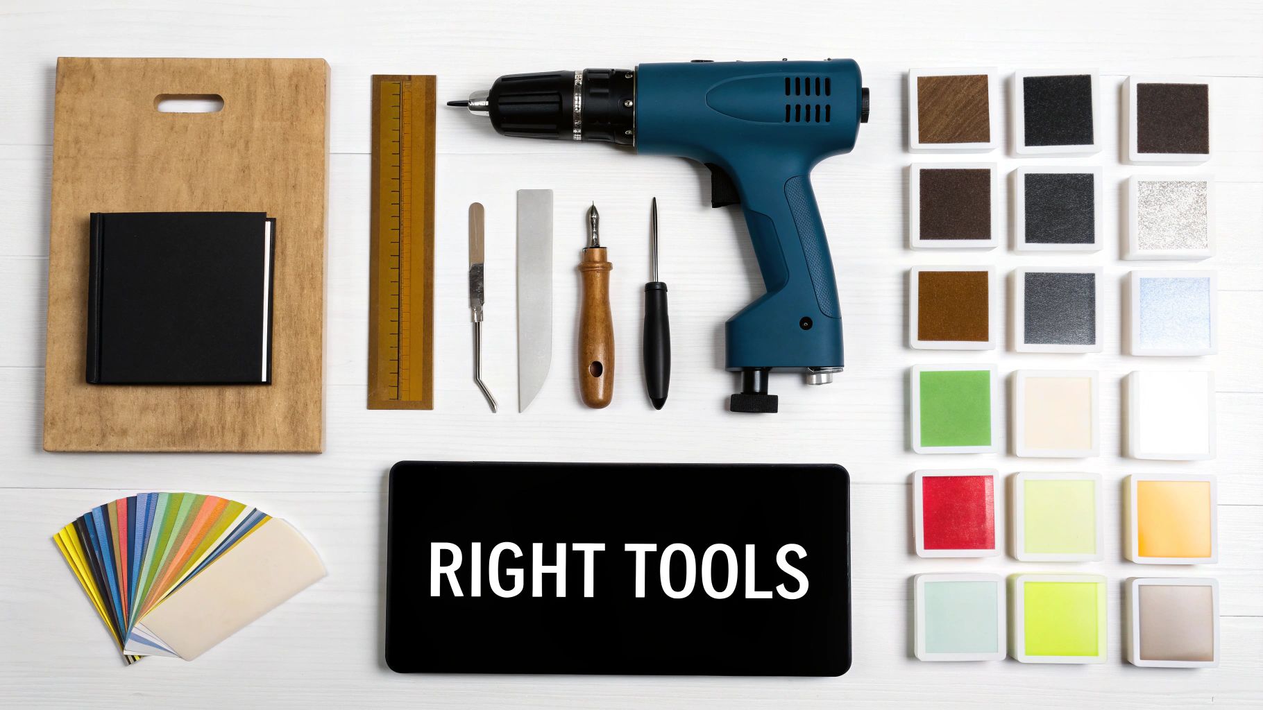 A flat lay of various craft tools, a drill, a tablet displaying 'RIGHT TOOLS', and colorful ink pads.
