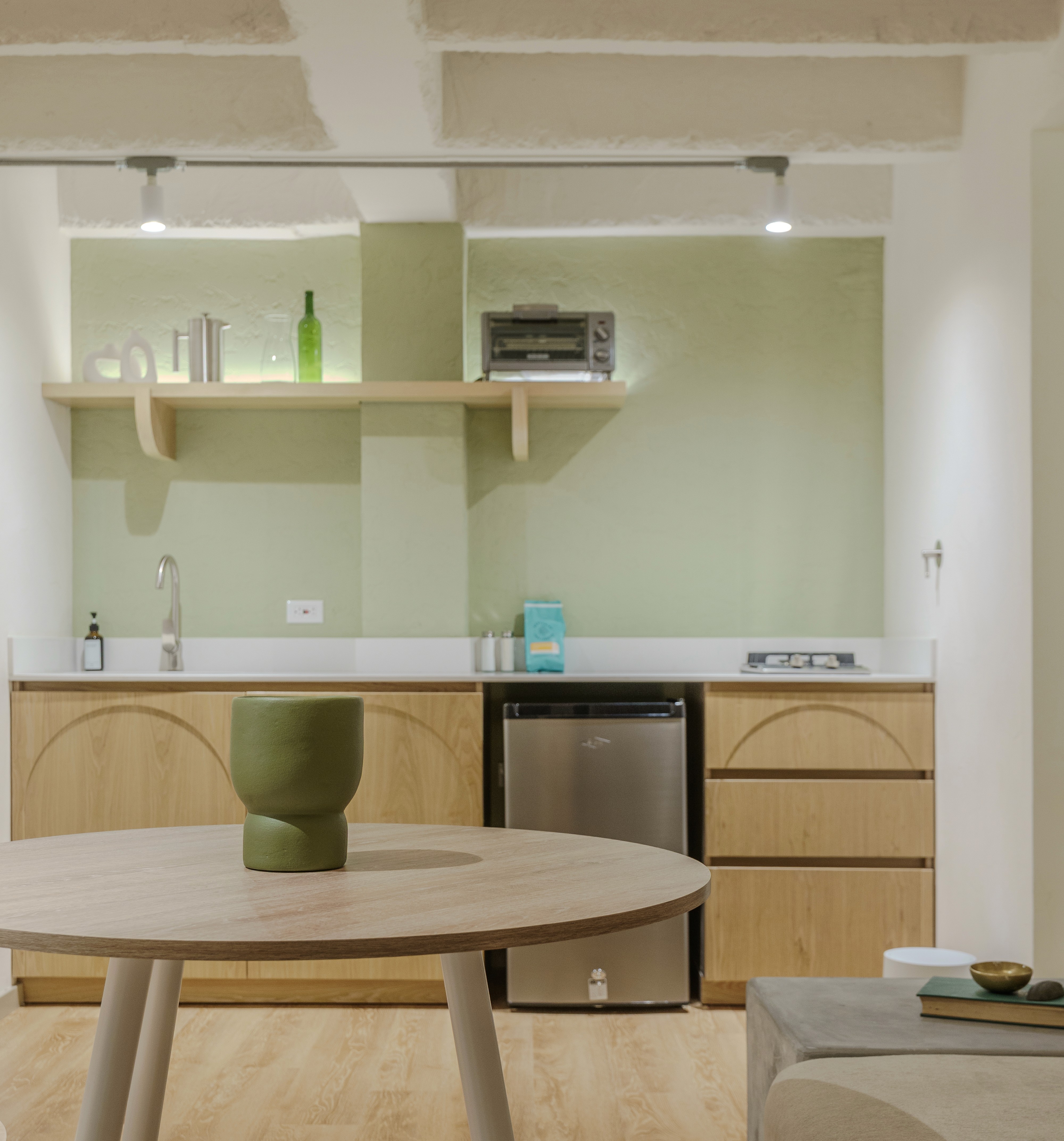 Double-height interior with flowing sculptural forms and warm raking light