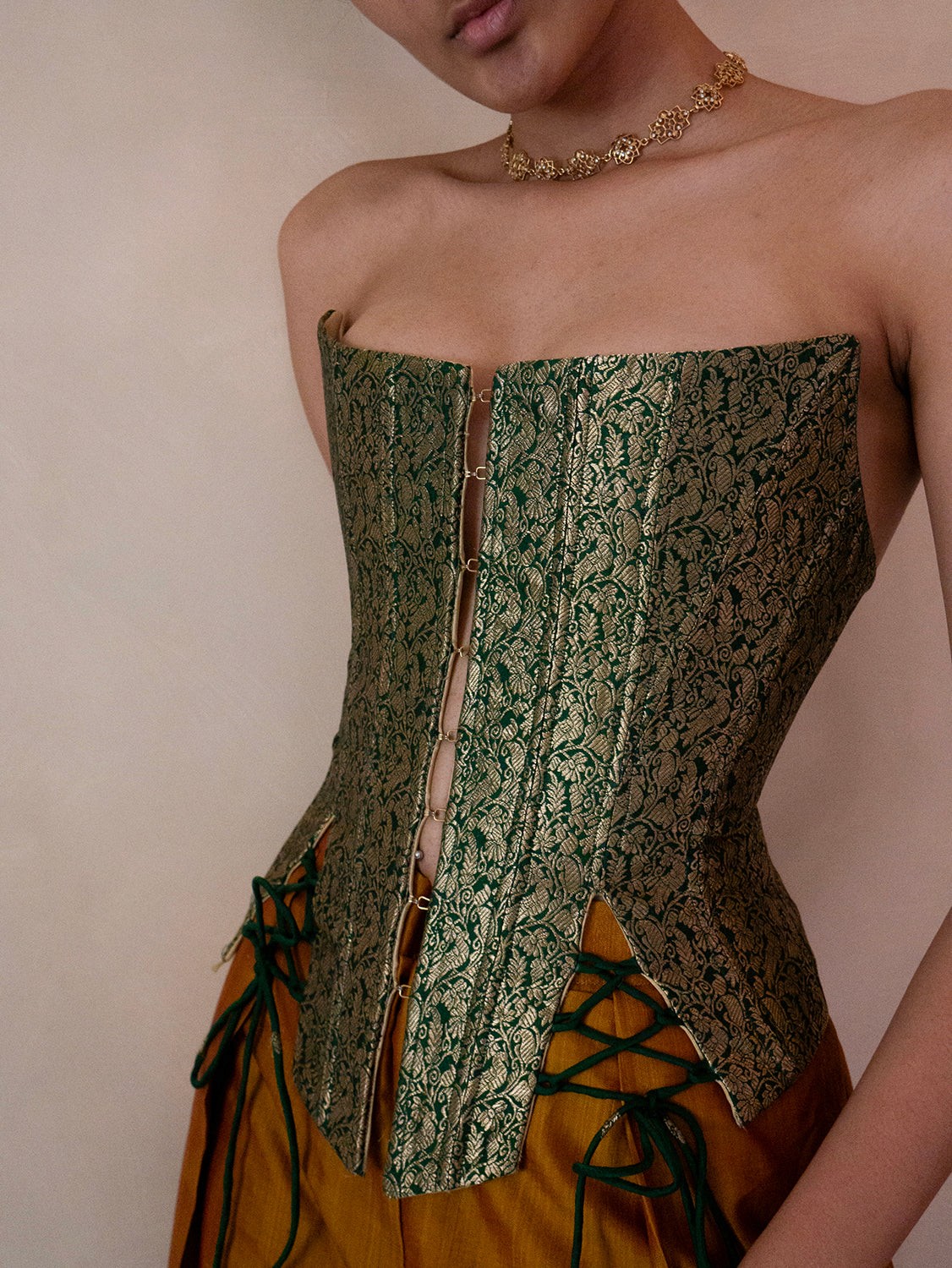 Raina is our one-of-a-kind four-panel corset, handcrafted in-house using a brocade silk saree.