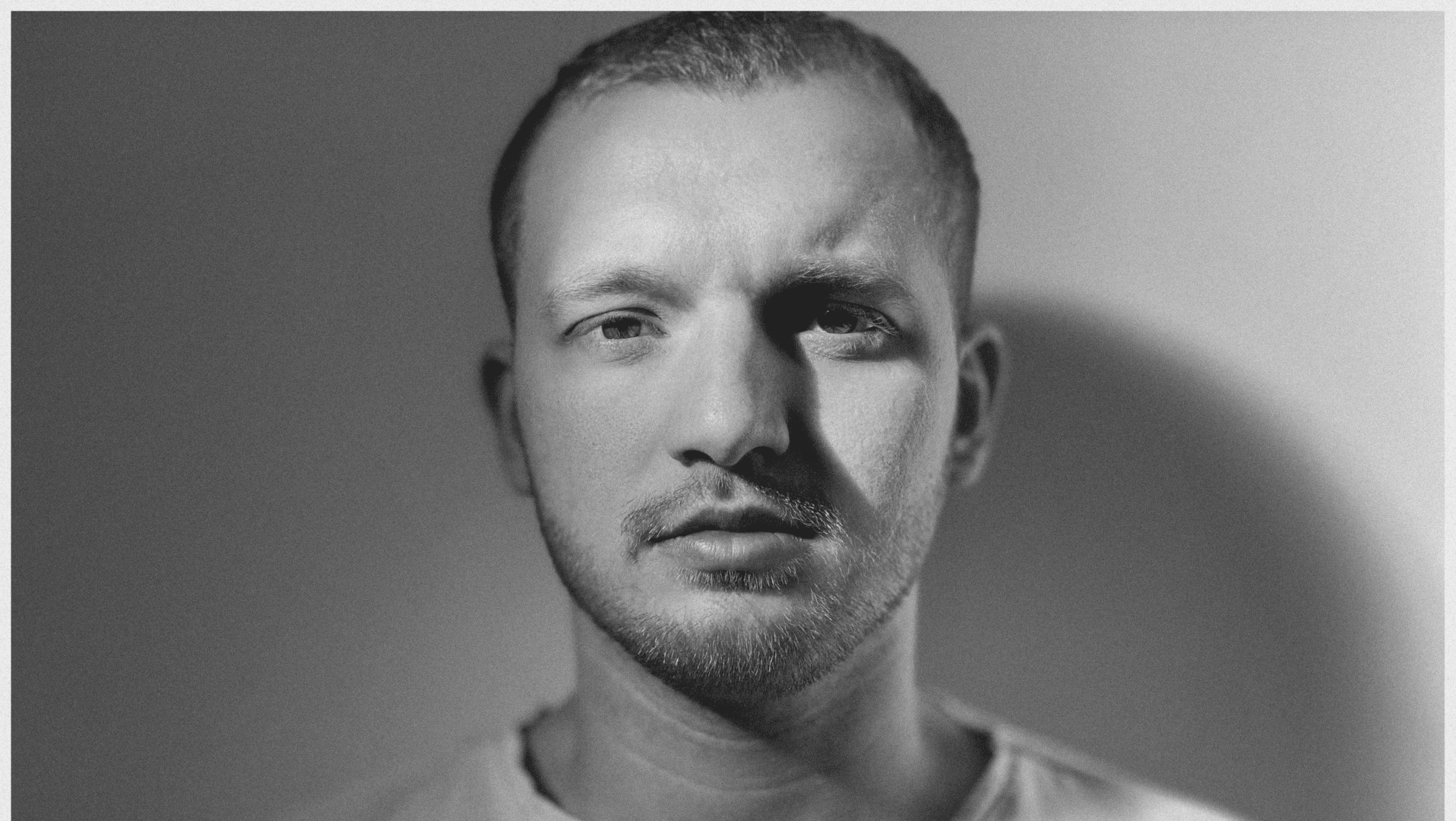 grayscale photo of woman wearing necklace and top