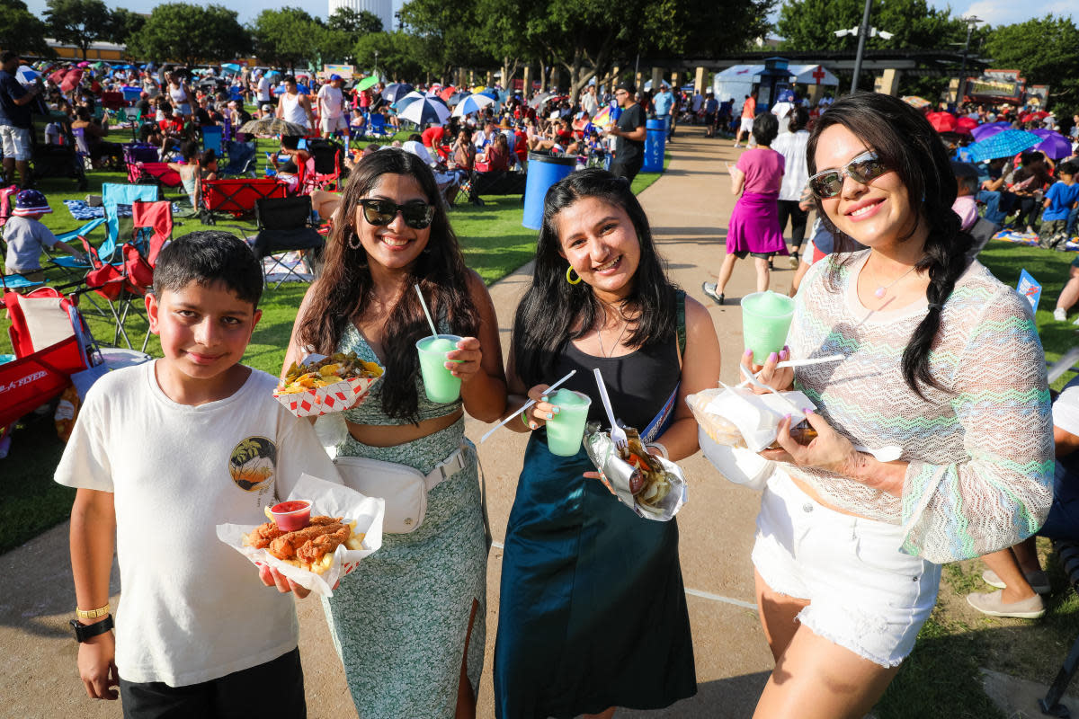 Crowd enjoying food trucks and outdoor dining at a Houston spring food festival in April