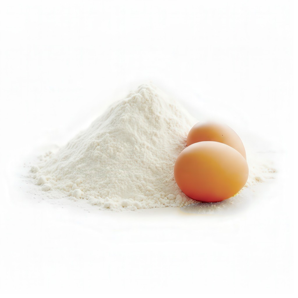 A pristine white mound of flour sits beside two smooth, brown-shelled eggs, representing essential baking egg products.