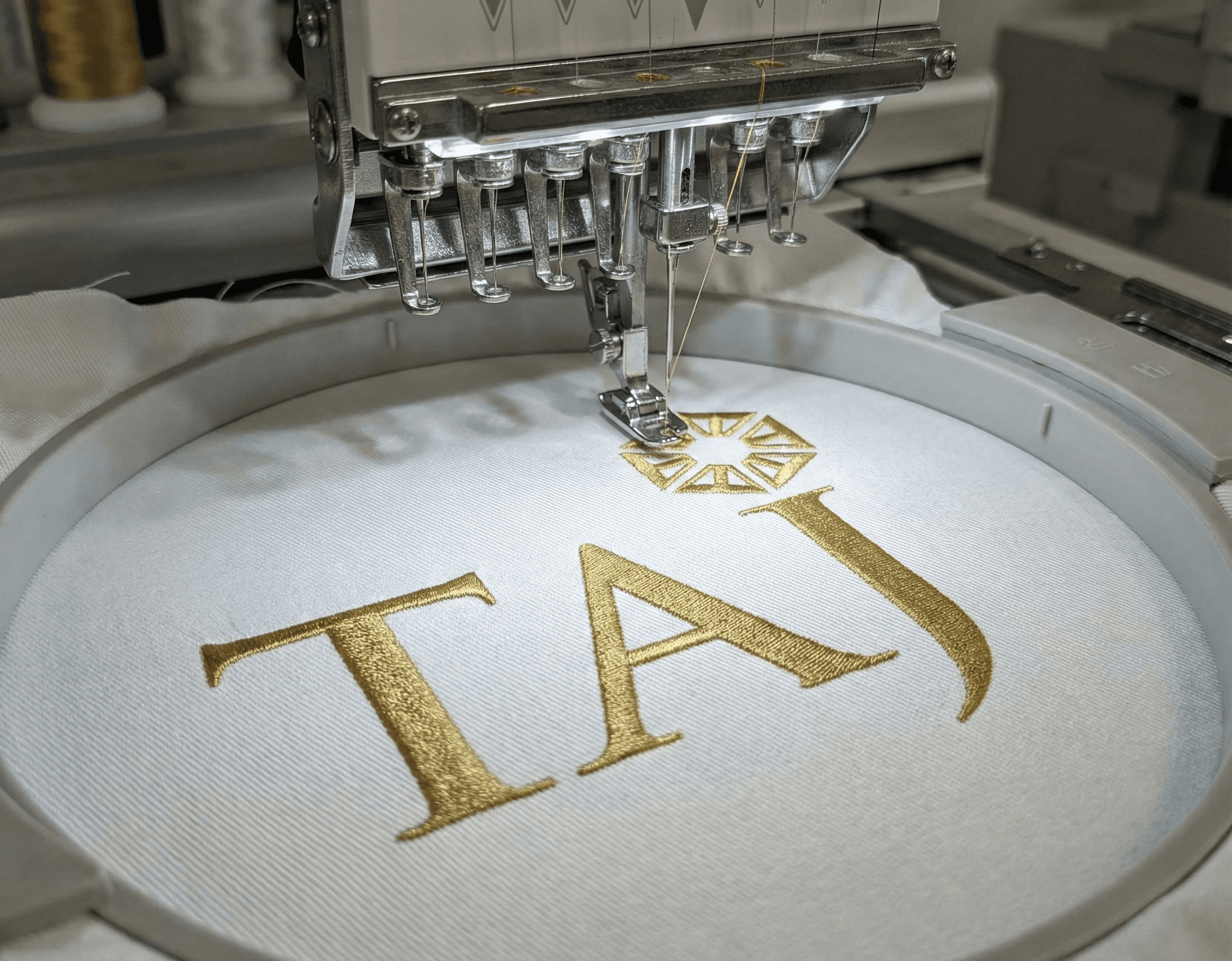 Taj logo custom embroidery