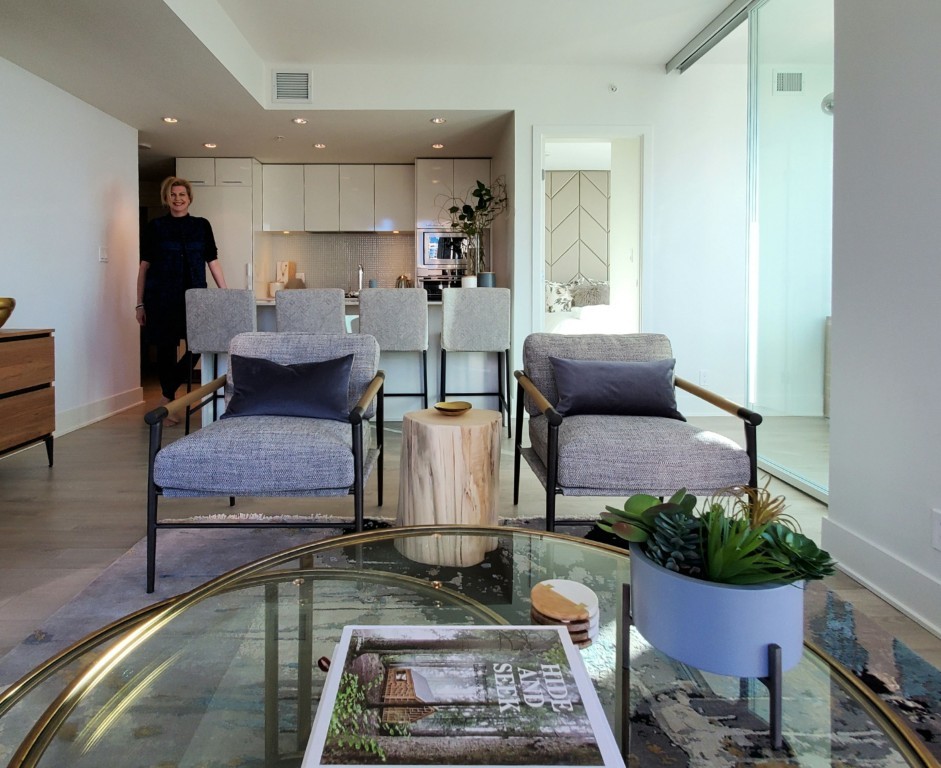 Image of Modern living room interior with furniture, kitchen, and KHD Homes design expertise on display nearby.
