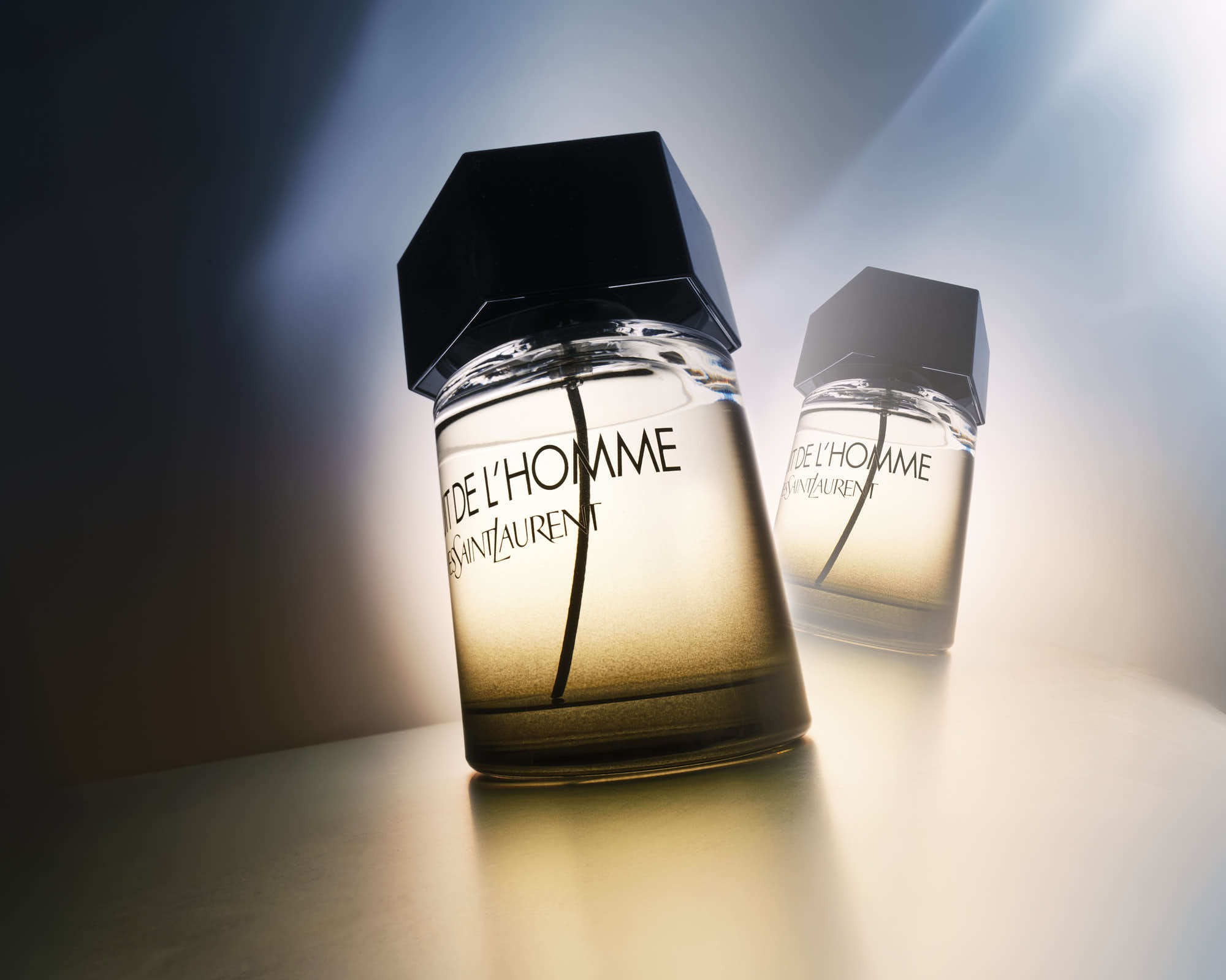 Yves Saint Laurent La Nuit de L'Homme cologne bottle in soft lighting.