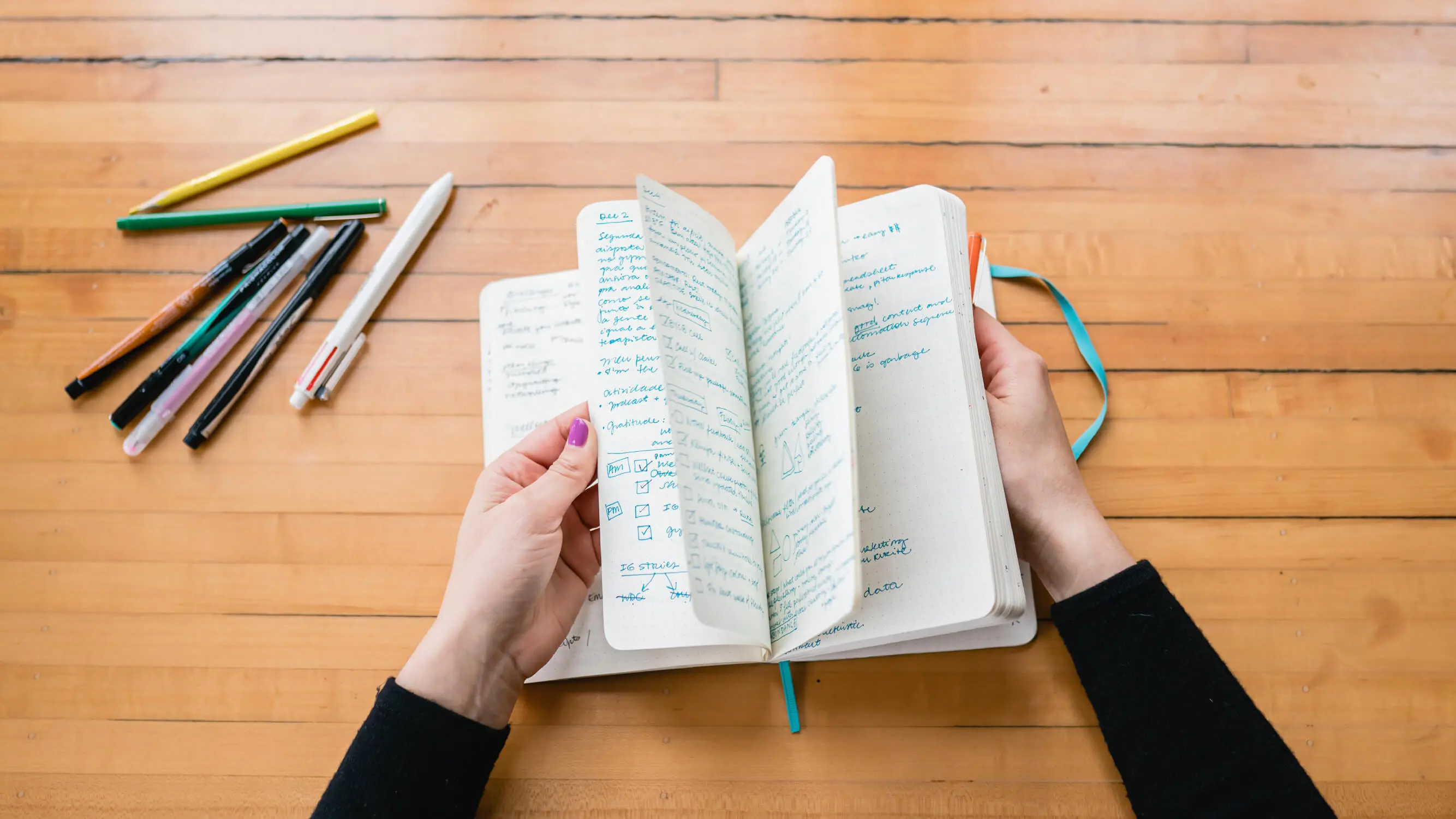 brand designer flipping through sketchbook