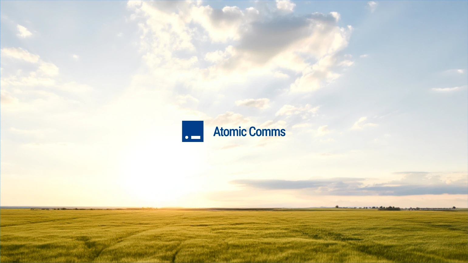 Atomic Comms horizontal lockup slide