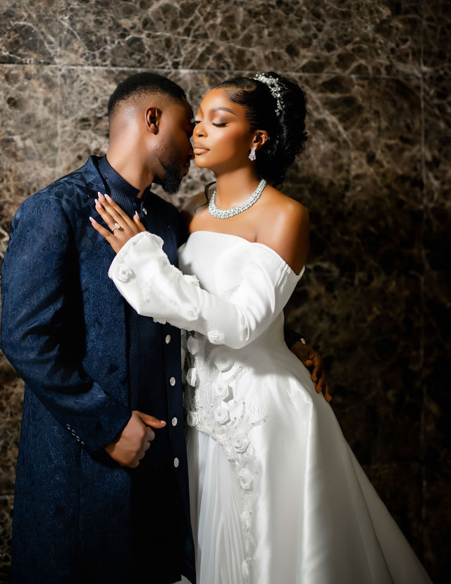 Groom in blue suit and Bride in white dress