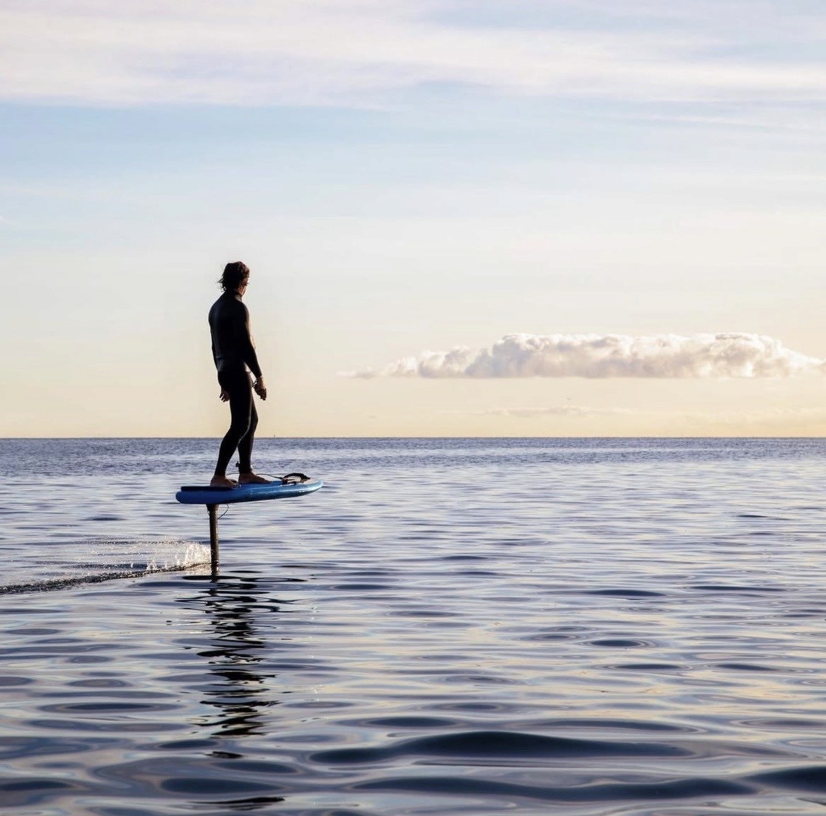 Man with surfing with paddle