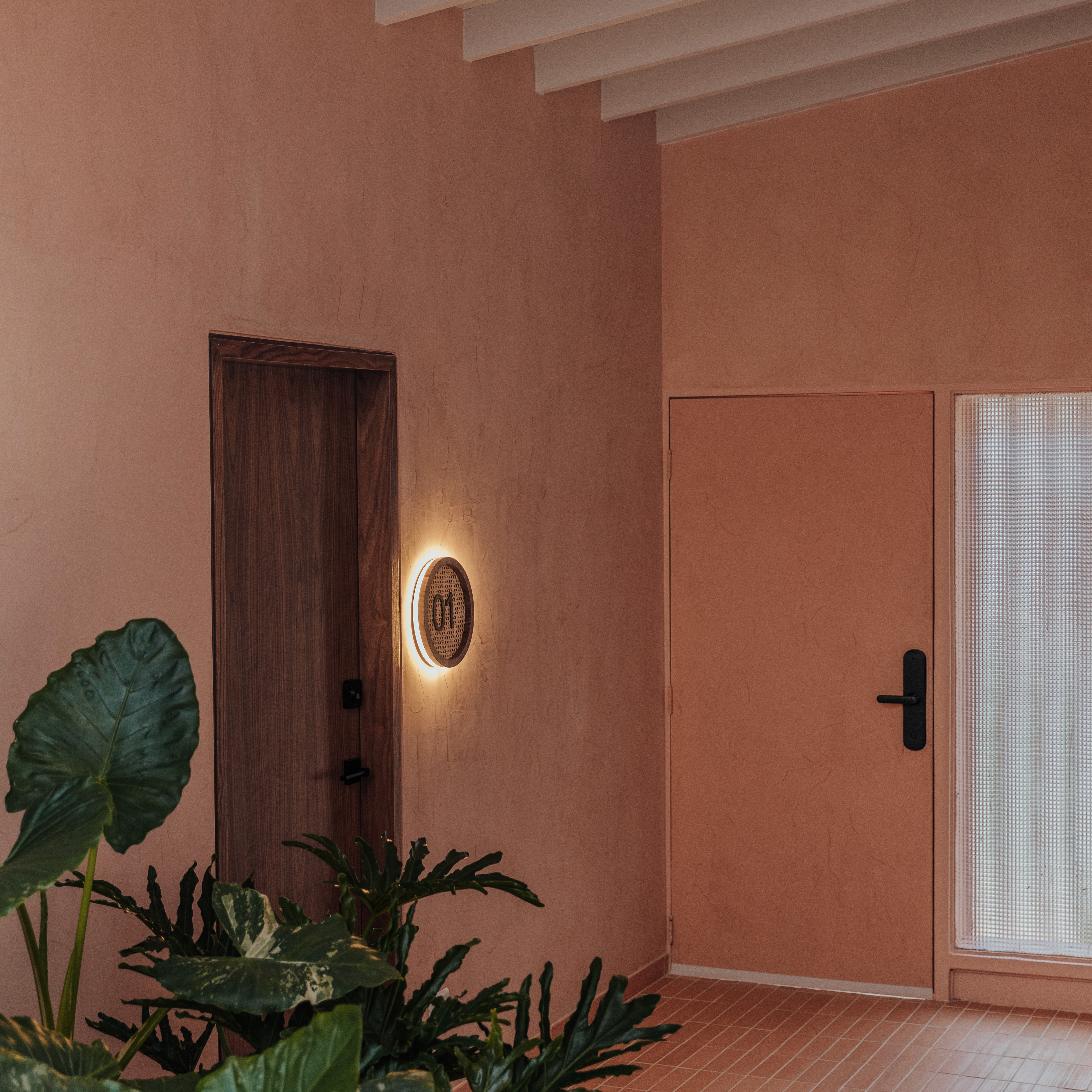 Double-height interior with flowing sculptural forms and warm raking light