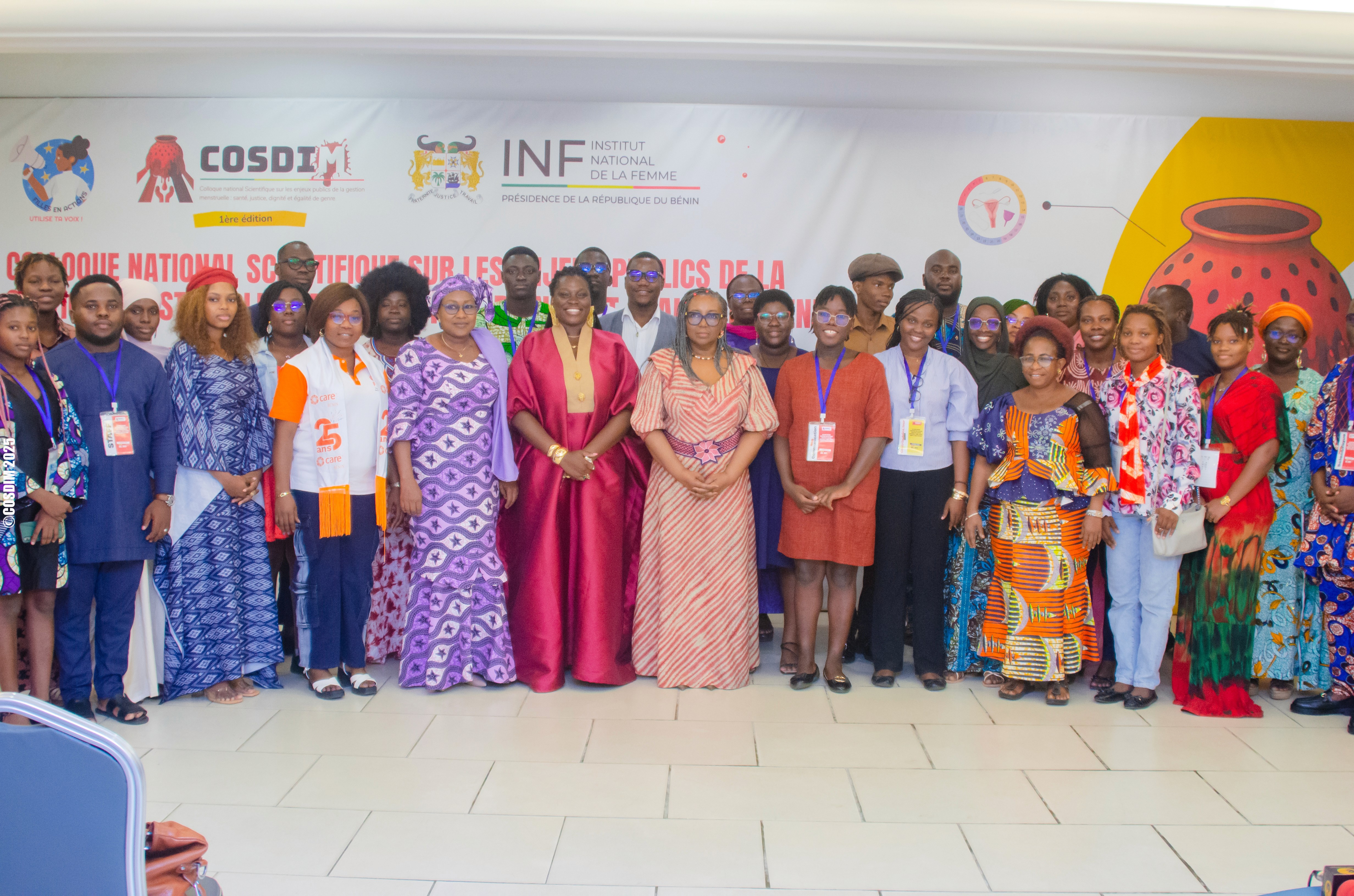 Close-up of lush, dark green leaves, some glossy and wet, against a muted background.