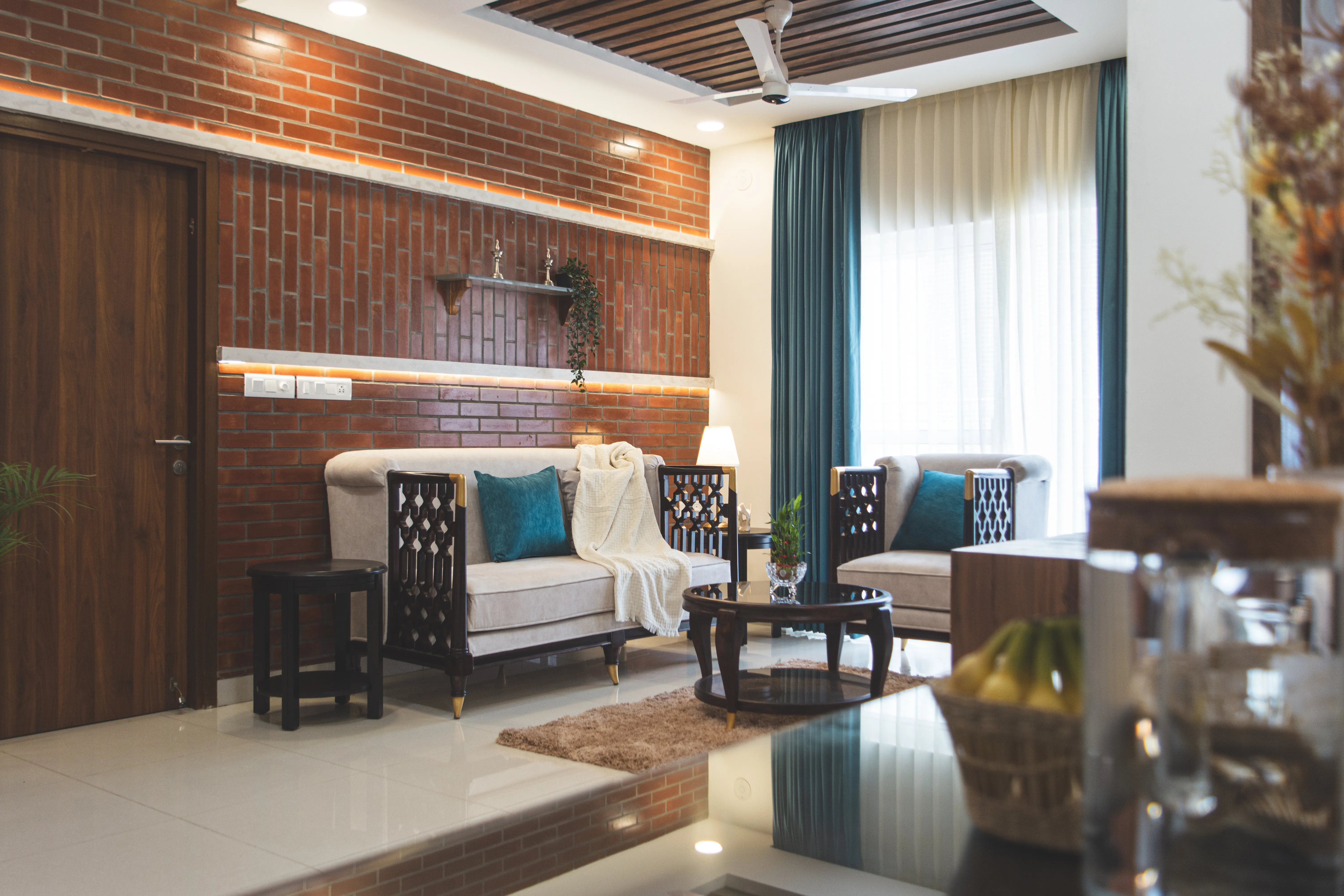 Modern Interior with Brick Aesthetic, South Indian Architecture, Blue Hues, Vintage Furniture