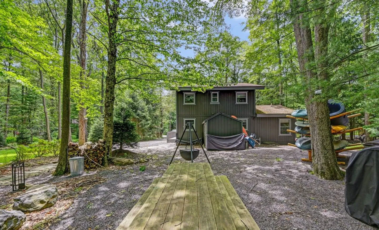 Front walkway and picnic table leading to the gray chalet at Mountain MAMA, Pocono Pines, PA