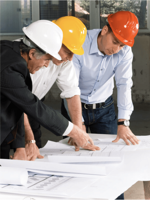 Three engineerings looking over a project map