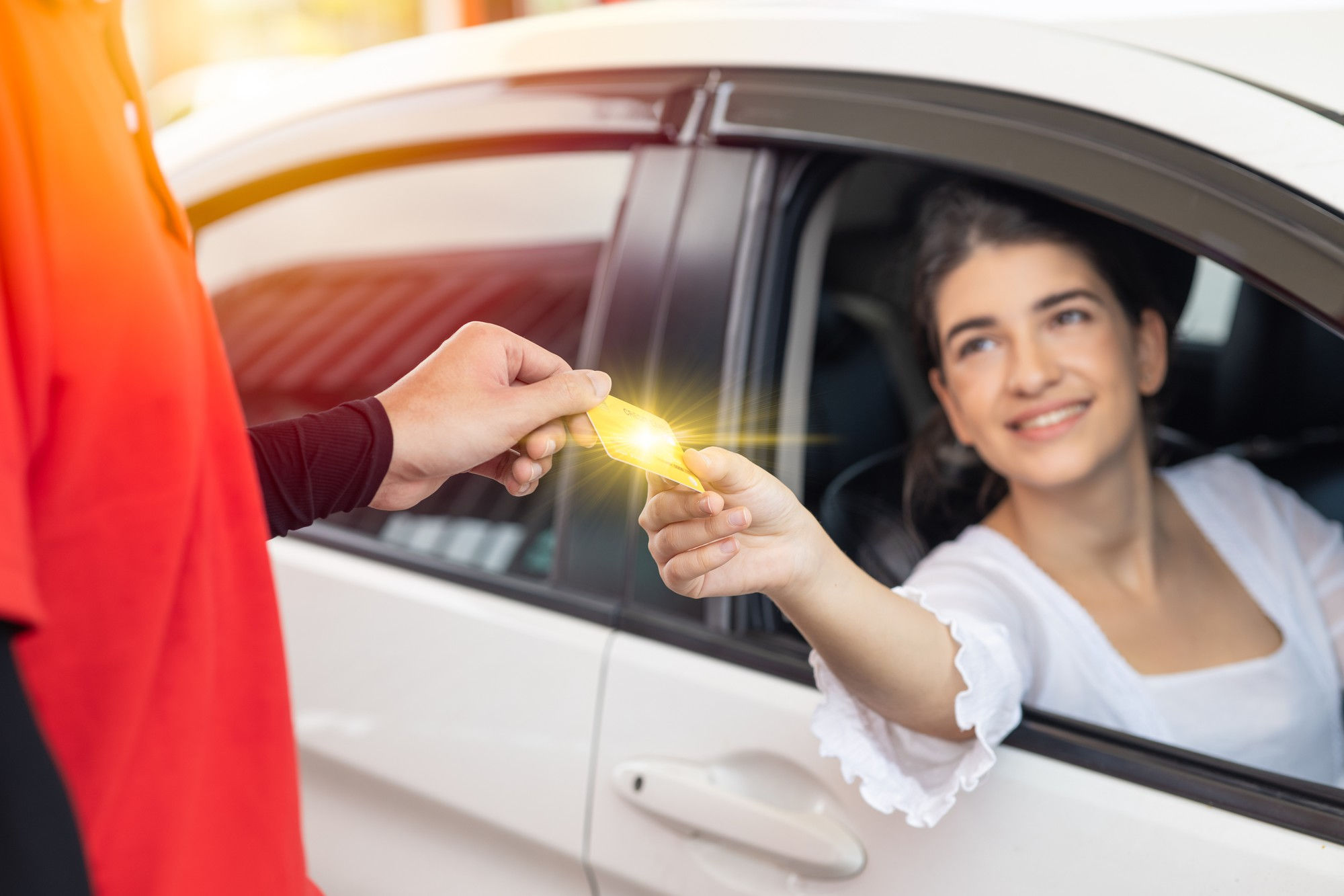 A woman gives a man a key to his car, representing a gesture of assistance and collaboration in their relationship.