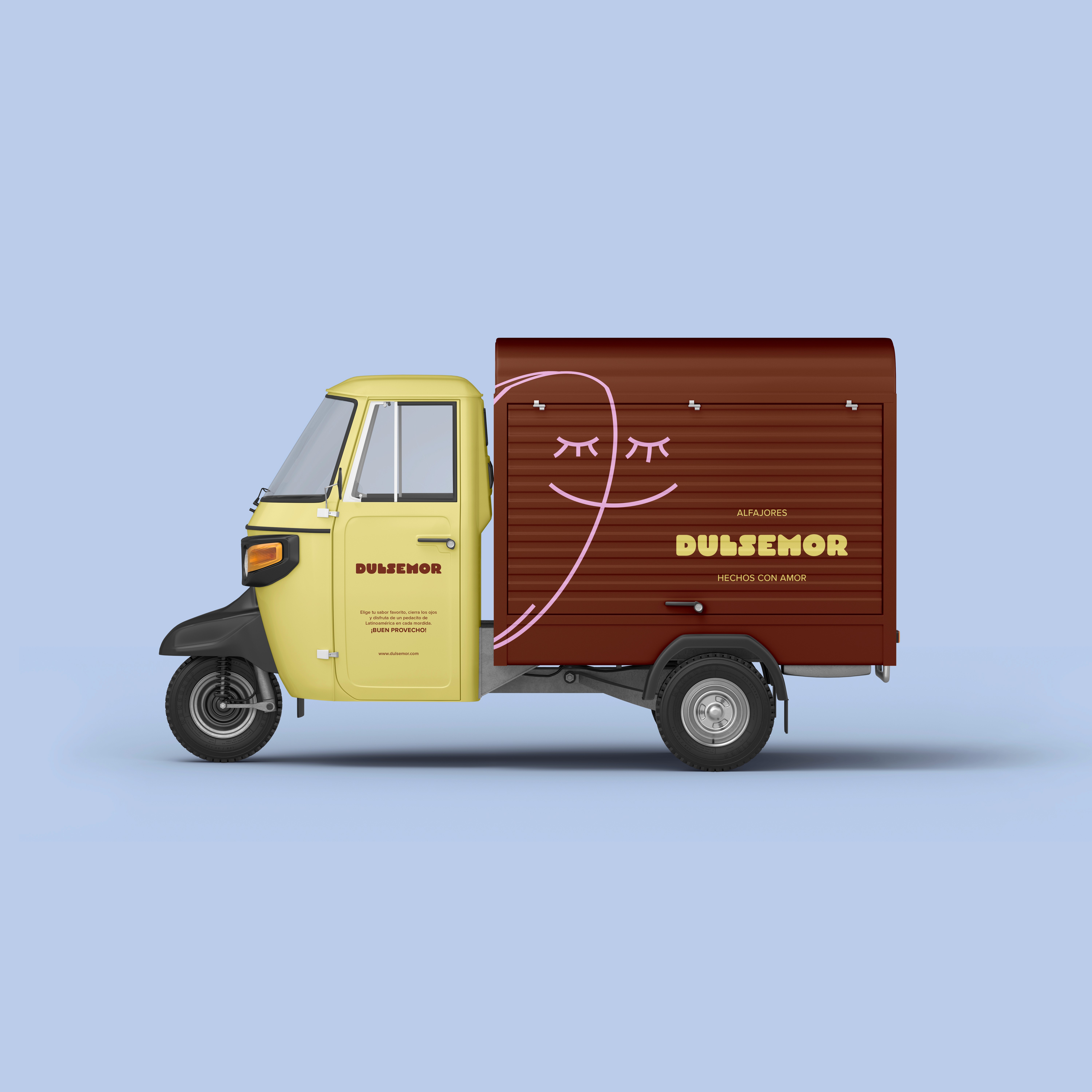 Yellow and brown DULSEMOR three-wheeled delivery truck with a smiling face graphic and branding on a light blue background.