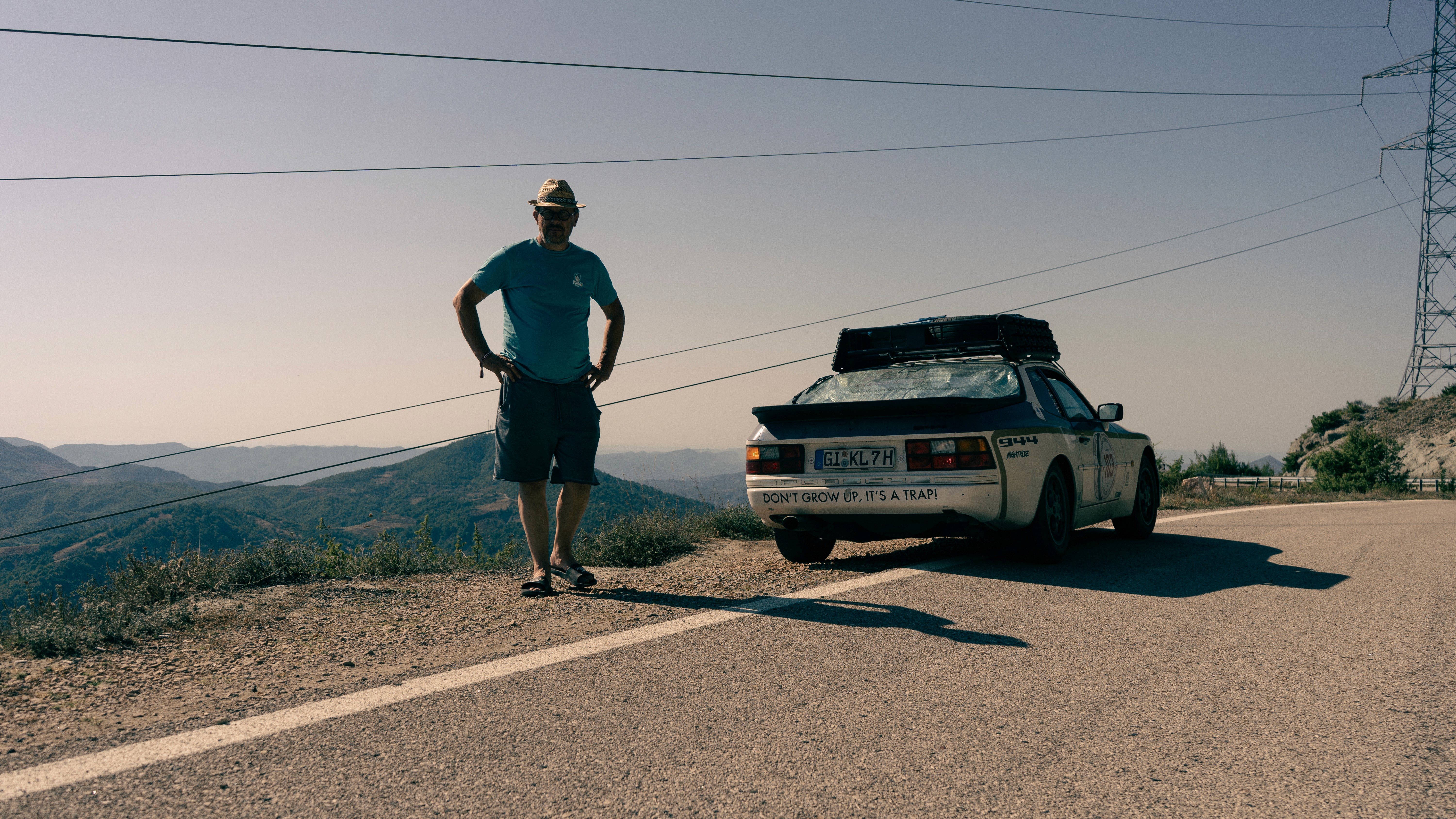 A close-up view of dark green leaves, creating a lush, textured background with subtle variations in color.