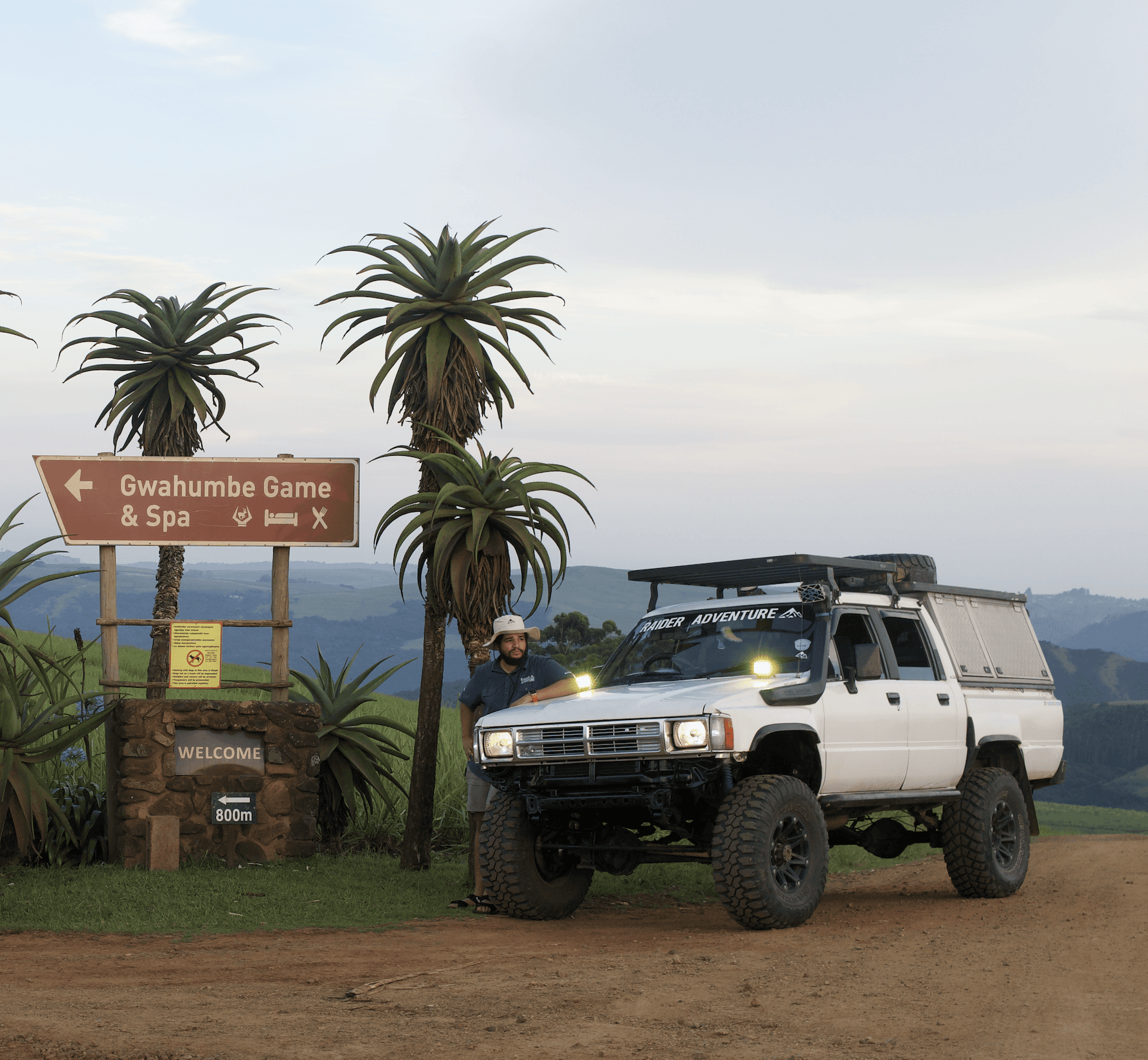 woman holding a phone and man looking at the phone. both are smiling
